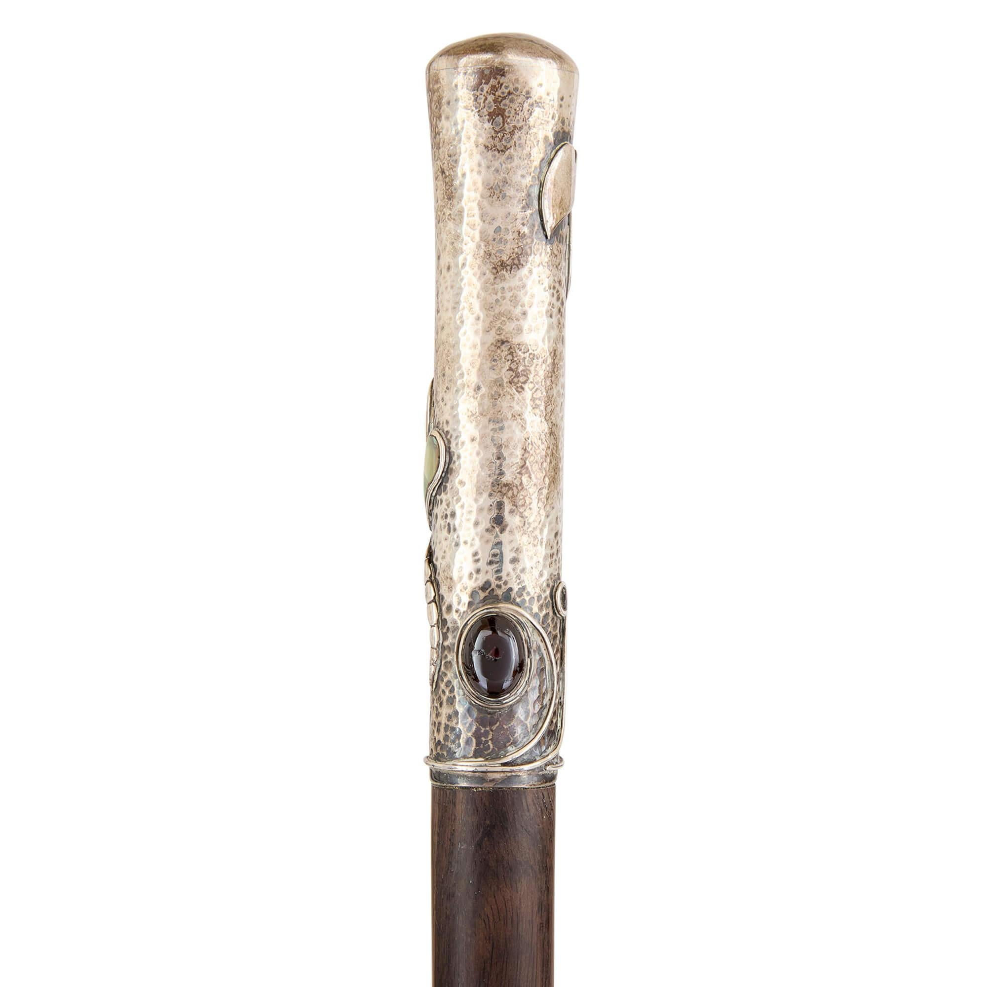 Art Nouveau silver, mother of pearl and glass walking stick  
French, c. 1900 
Height 87.5cm, diameter 3cm 

This walking stick was crafted at the height of the Art Nouveau movement and embodies the era’s signature fluidity and reverence for the