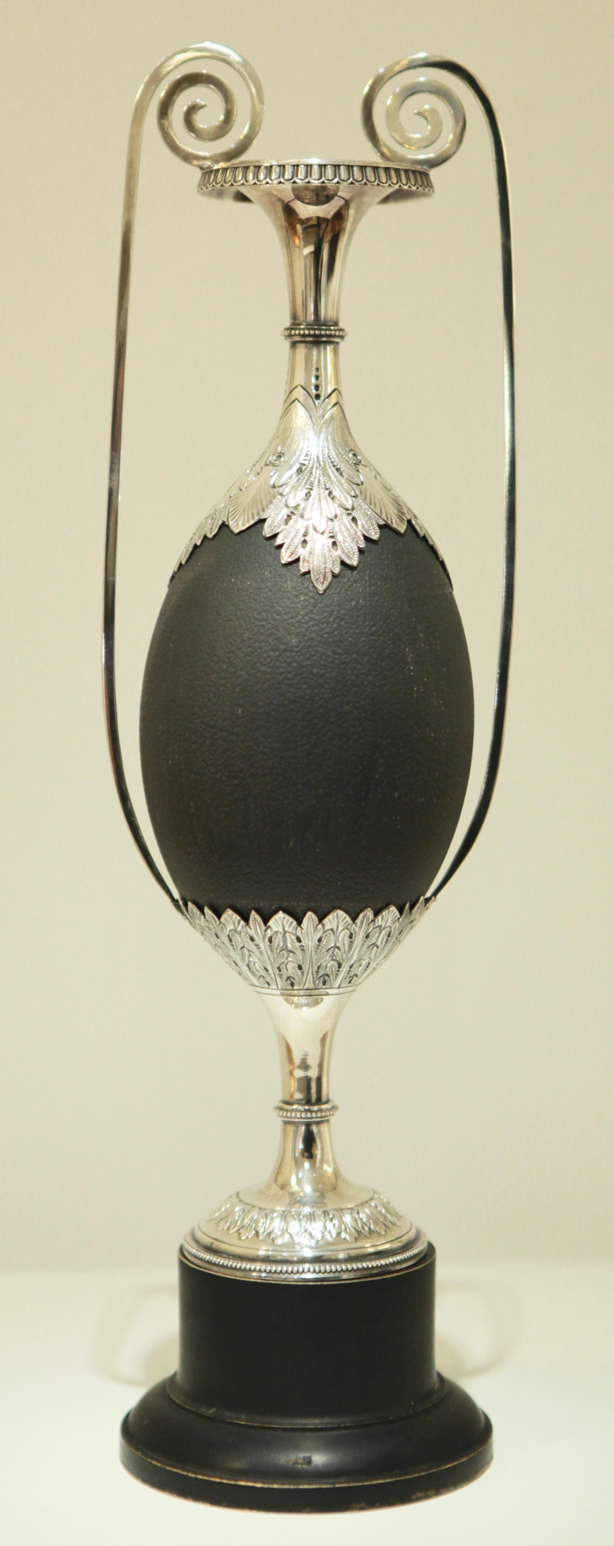 Art Nouveau silver mounted Australian Emu egg on a black wooden base,
Manufactured, circa 1900 in Adelaide, South Australia
Very fine Silver work, attributed to Henry Steiner
Unsigned.