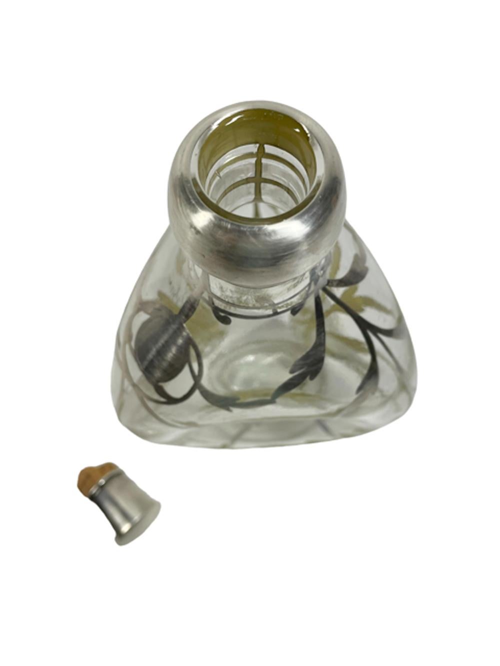 Art Nouveau sterling silver overlay clear glass pinch decanter with three dimpled sides and allover scrolling leaf decoration, with a silver overlay collar and sterling capped cork stopper.
