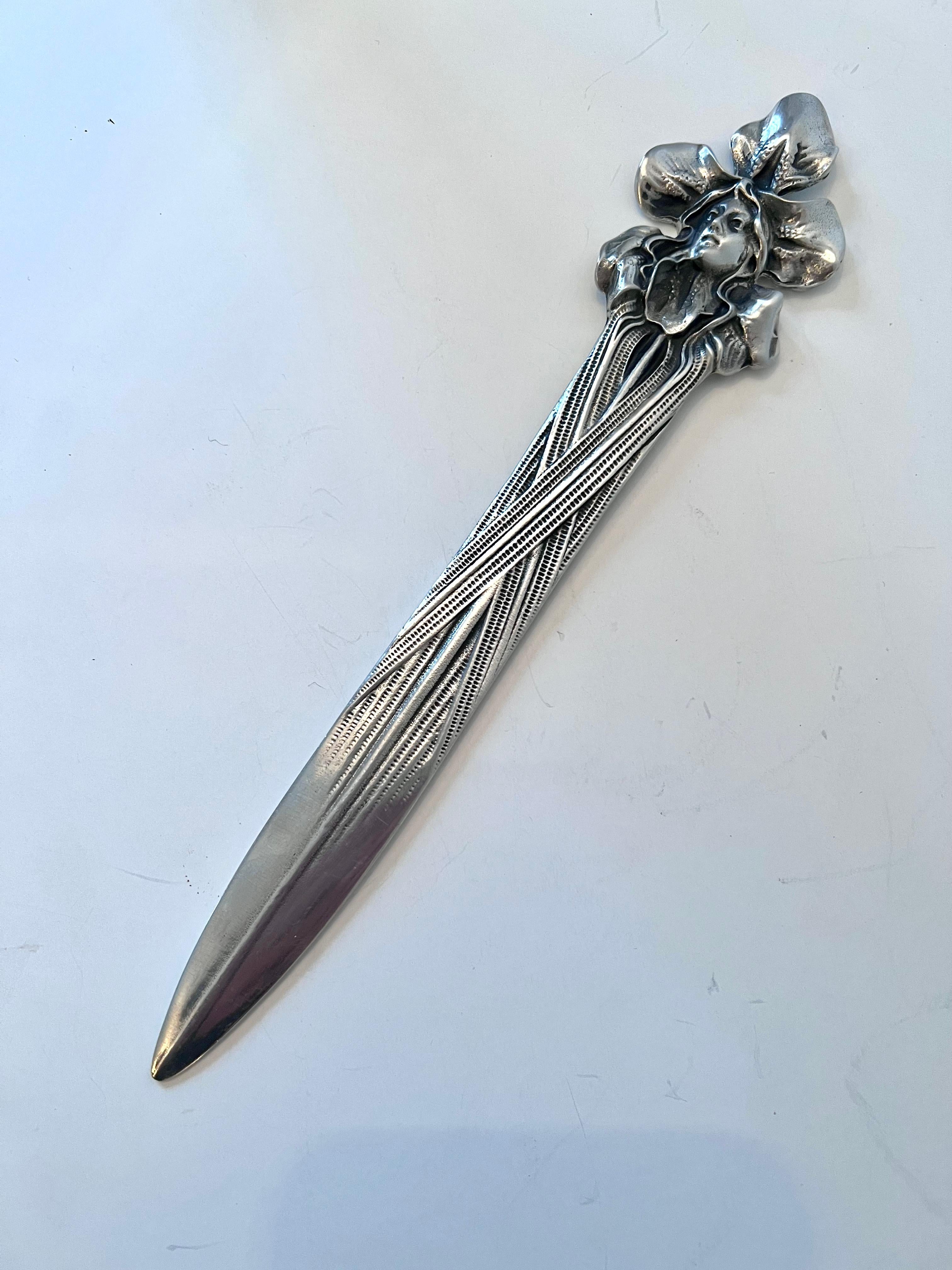 A large and solid silver pewter art nouveau letter opener featuring a lady - a wonderful decorative piece for any desk or work station.
