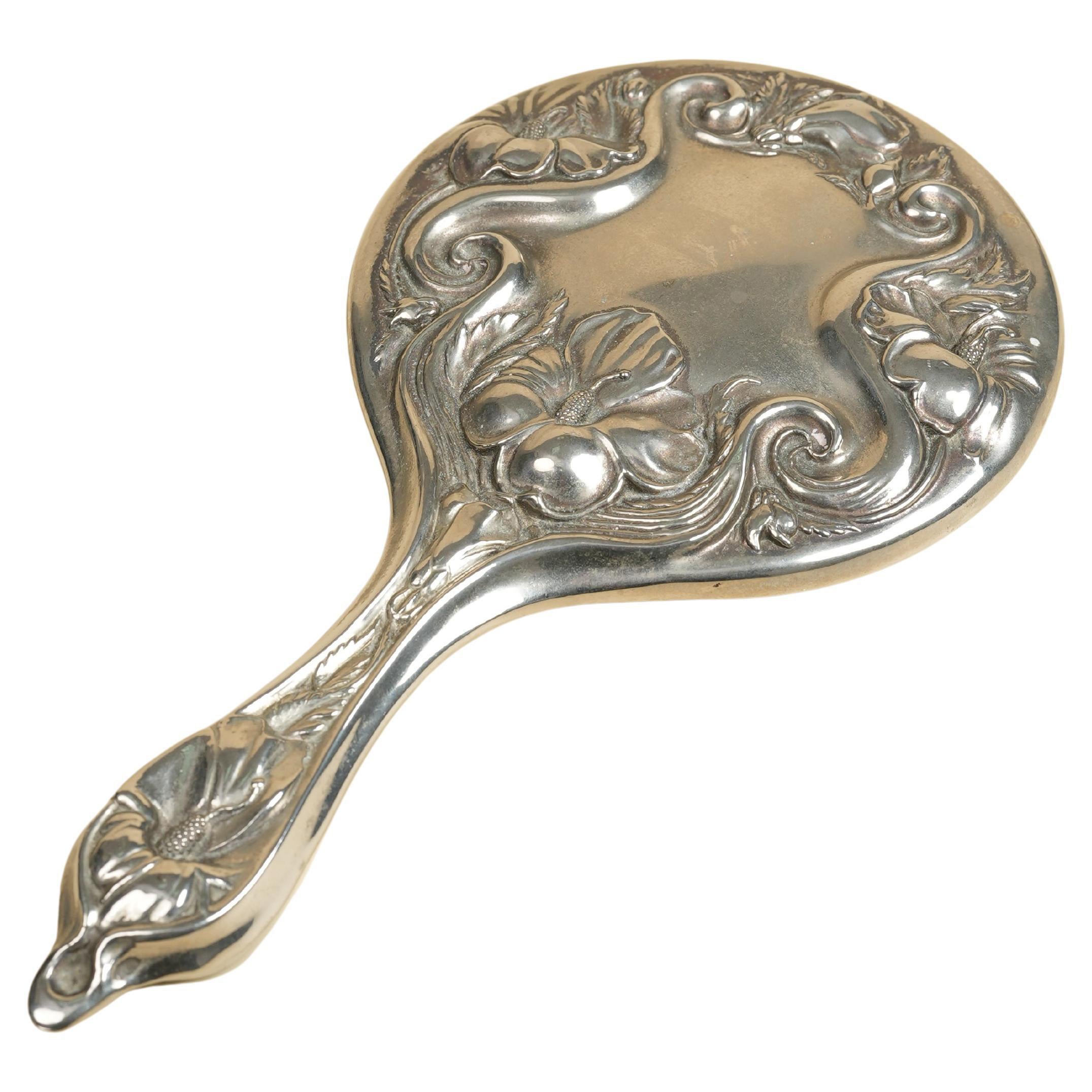 Miroir à main Art Nouveau en métal argenté