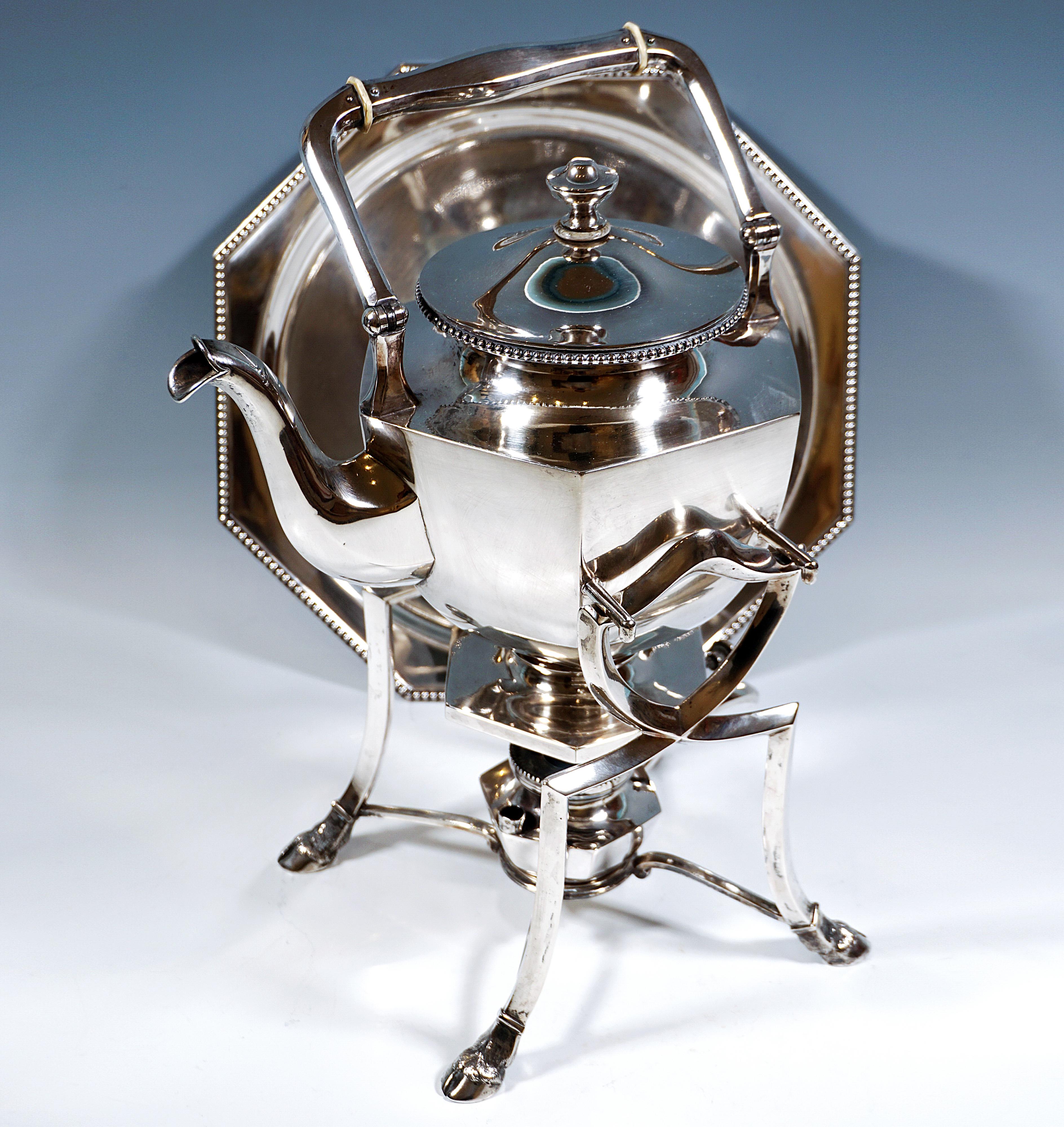 Elegant silver teapot with a hexagonal cross-section on a hexagonal offset stand, six-sided swan spout, round opening with pearl band decoration on the side, slightly domed press-in lid with monogram engraving and knob, movable, six-sided bow