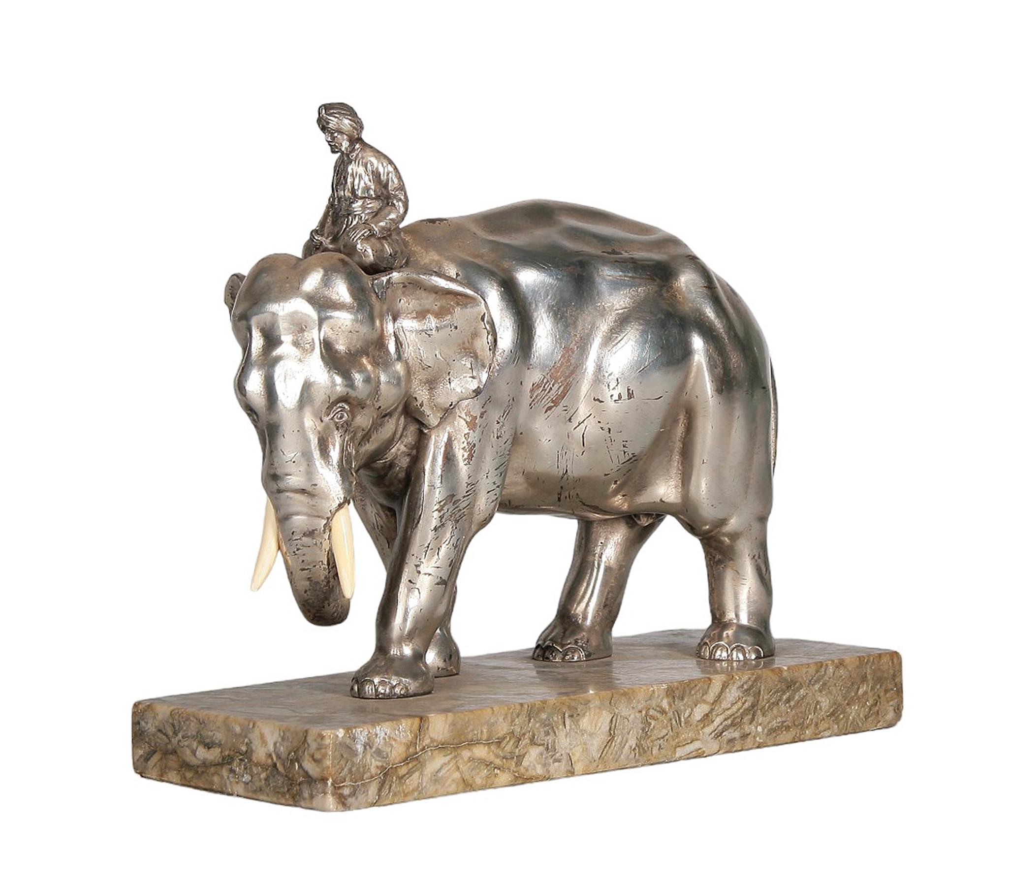 Ealy 20th century Art Nouveau silver-tone metal/bone elephant and rider sculpture with stone base, France

By: uknown
Material: metal, bone, stone
Technique: cast, molded, polished, metalwork, carved, hand-carved, hand-crafted
Dimensions: 4 in x 9