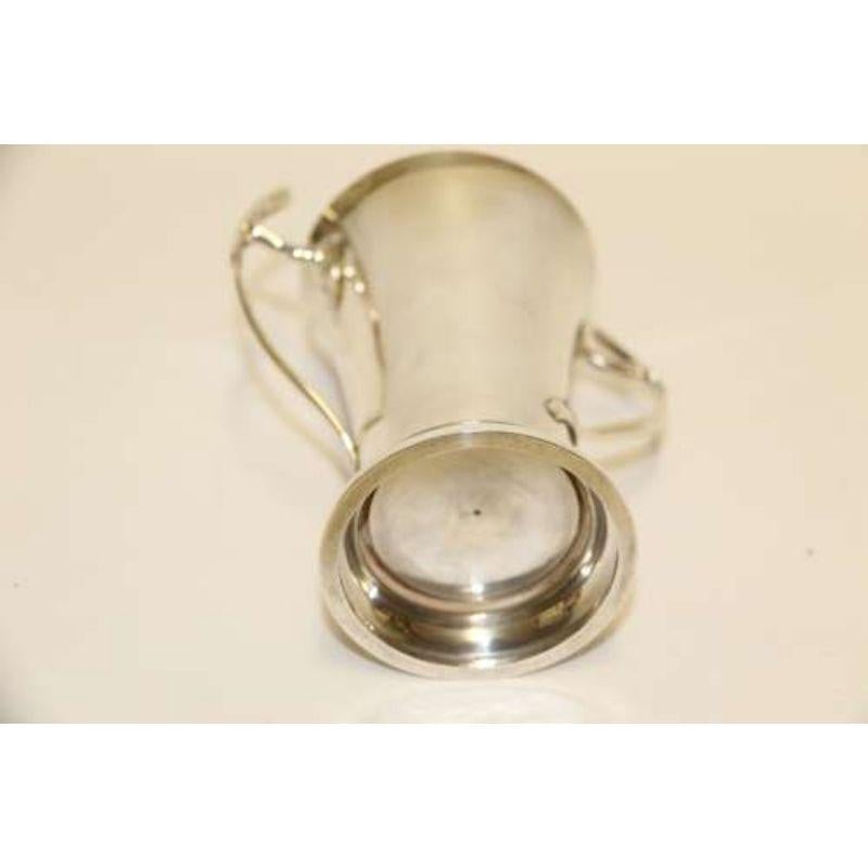 Art Nouveau silver vase

This stylish small silver vase is of restrained design with a plain flared body but greatly enhanced by the stylish twisting foliate handles to each side which gives the art nouveau following.
It was made in Birmingham