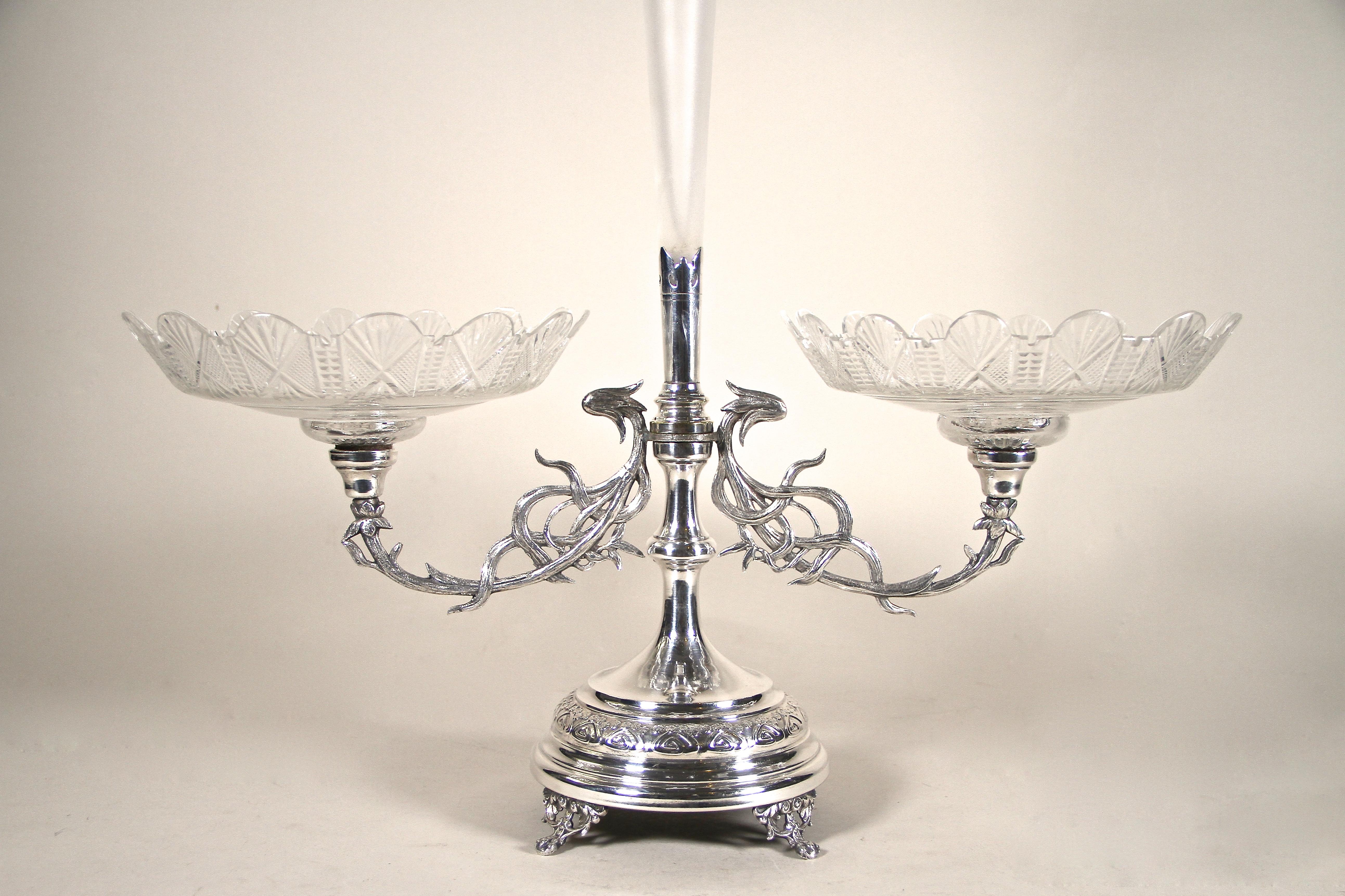 A true masterpiece is this large silvered Centerpiece with engraved glass bowls from the early Art Nouveau period in Austria. Artfully processed around 1900, this exceptionally designed centerpiece impresses with its lovely base, beautiful organic