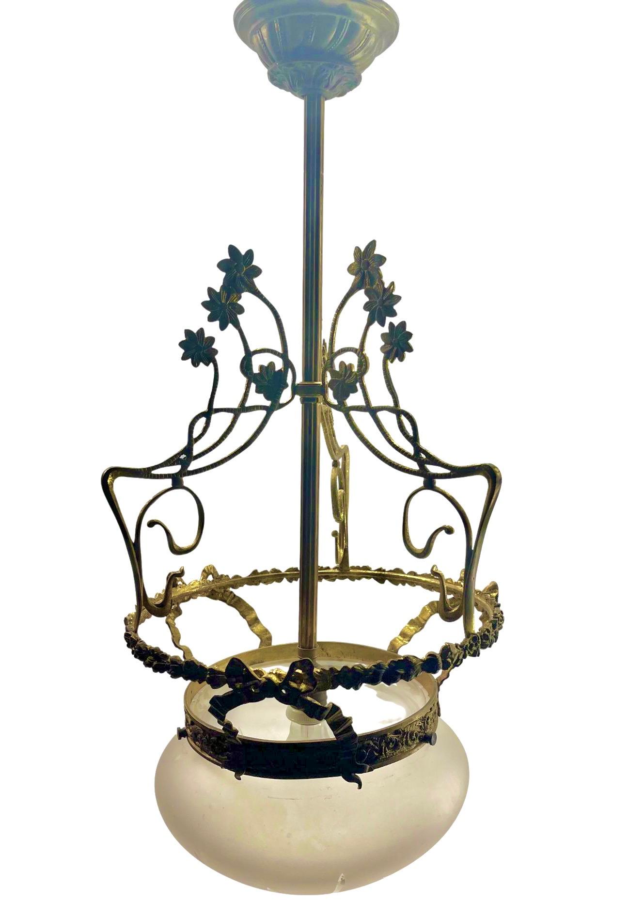 Art Nouveau Solid Brass Chandelier With Floral Decorations  1930s

Photography fails to capture the simple elegant illumination provided by this lamp.
In Good condition and in full working order having recently been re-wired and Originel fitting