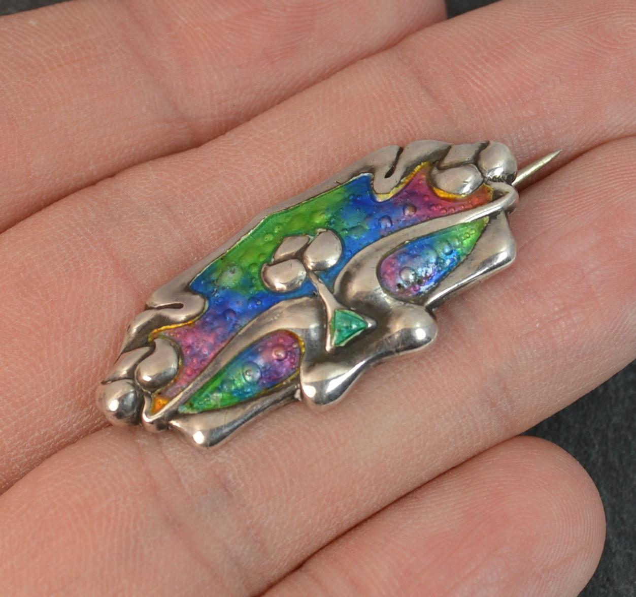 

A beautiful quality ladies solid silver brooch. English hallmarked piece. Art Nouveau period piece. Stunning enamel and shape.

Hallmarks ; full set of hallmarks, difficult yo read
Weight ; 4.6 grams
Size ; 3.5cm x 1.5cm approx
Condition ;