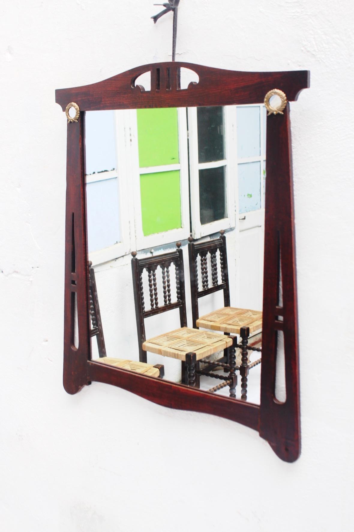Art Nouveau Spanish very thin wood wall mirror with brass accents, 1900s.