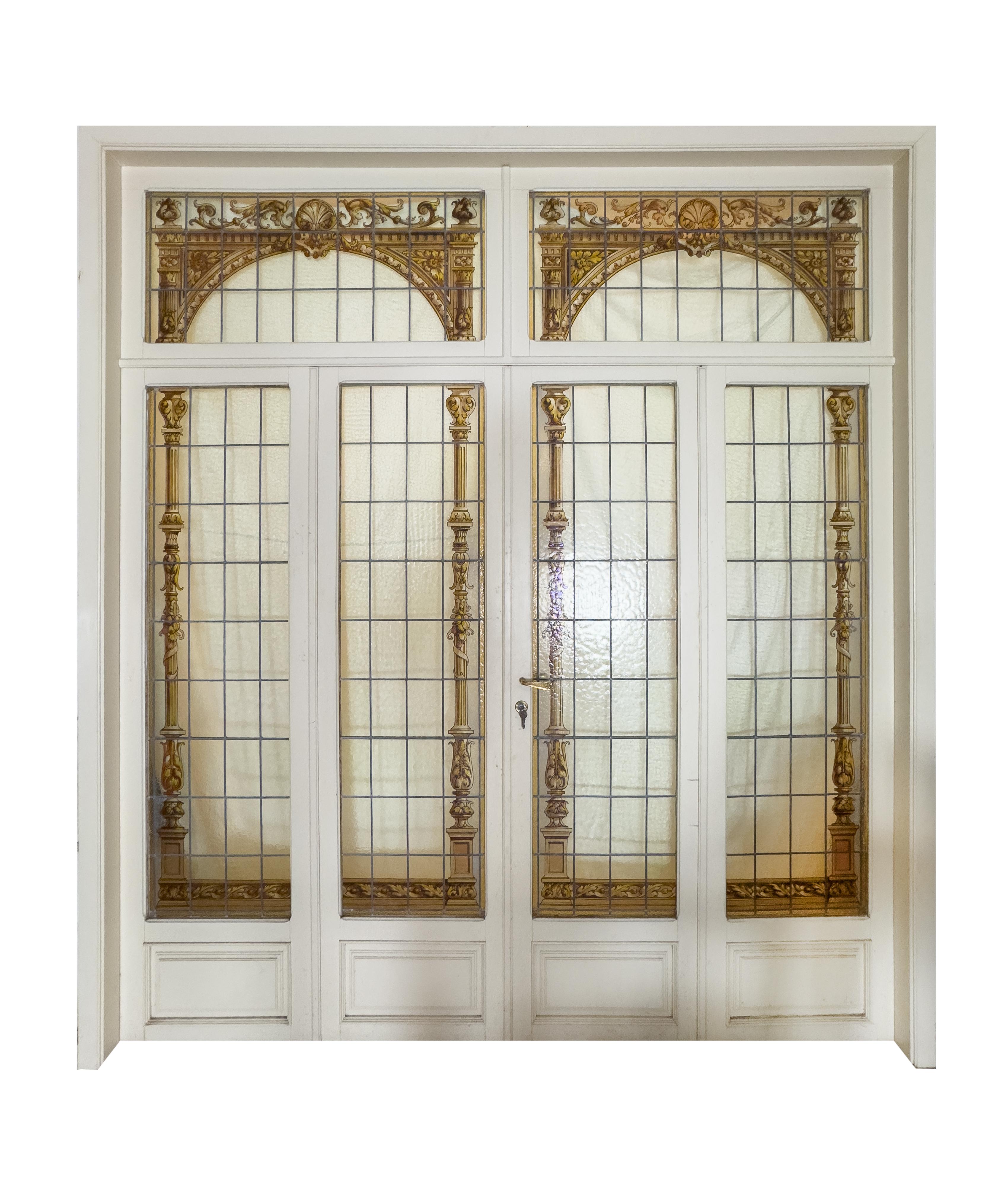 Complete set of six flawless panels, French stained glass in polychrome glass with shutters, locks, handle and original key.

Beautiful stained glass from the Art Nouveau period with rich polychrome decoration with geometric and vine  patterns. 4