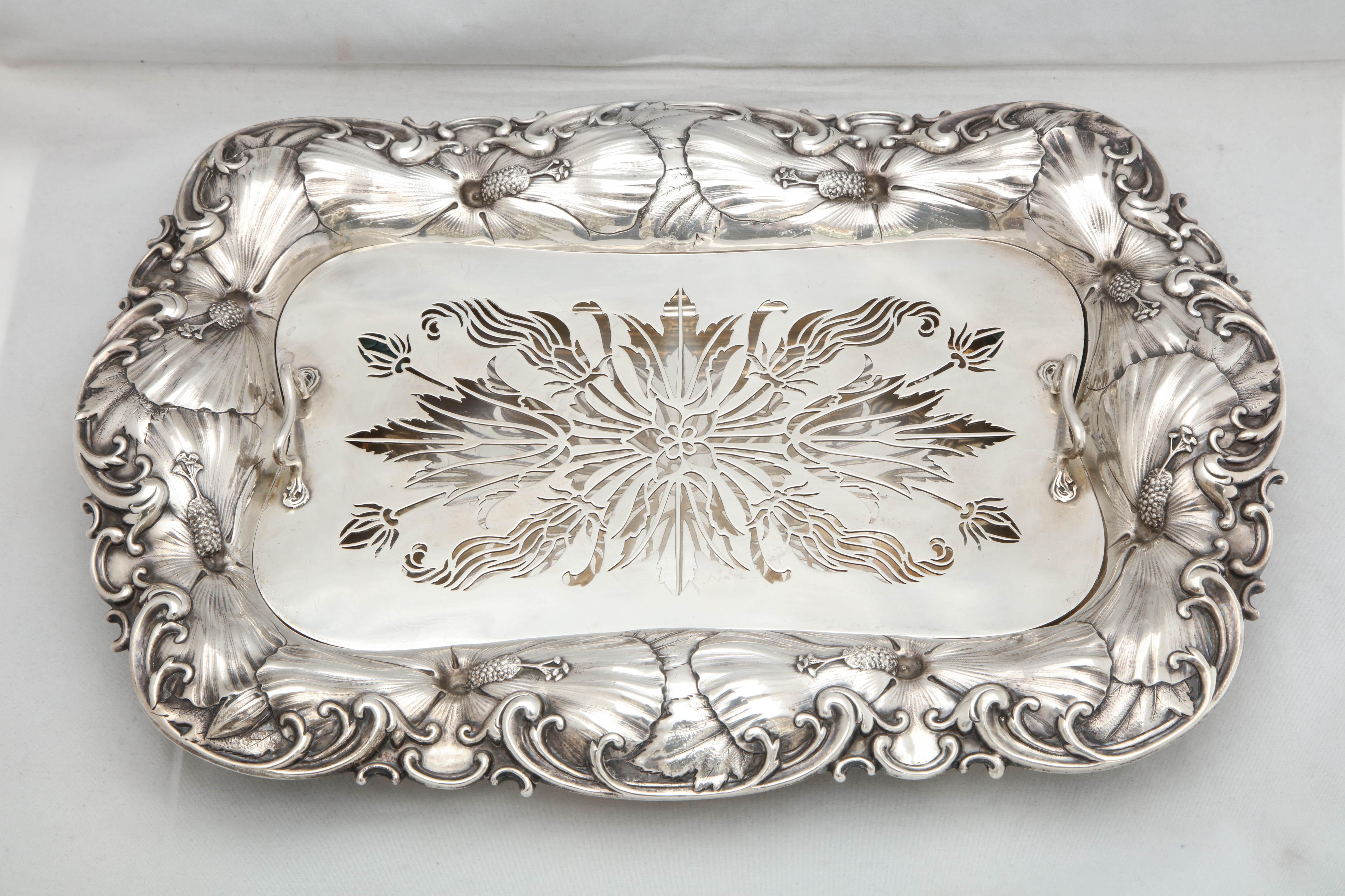 Art Nouveau, sterling silver asparagus dish with matching, sterling silver, removable liner, Whiting Mfg. Co., New York, circa 1900. Pierced, handled liner. Chased with Art Nouveau flowers and scrolls. Measures 16 1/4 inches long x 11 inches deep x