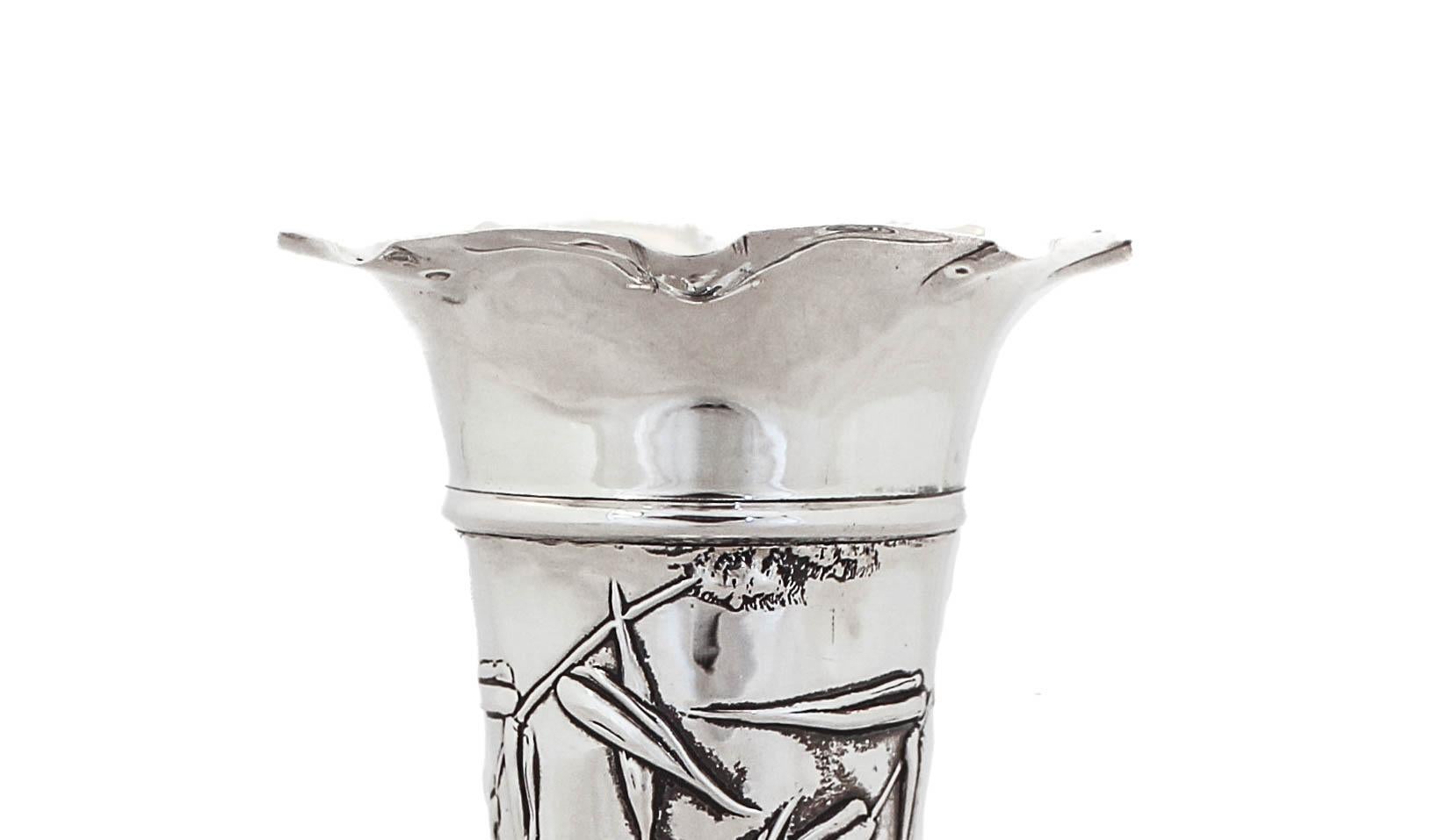 Designed at the height of the Art Nouveau period, this sterling silver bud vase embodies all the essentials of the style. Manufactured by William Gamble of London, England (see hallmark photos). “Bird of Paradise” and “Lillies” decorate the entire