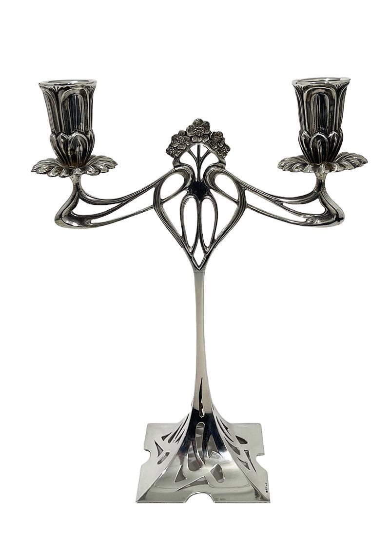Art Nouveau sterling silver candelabras, 1900-1920

A pair of candelabras in sterling silver in Art Nouveau style. This model was designed by Albert Mayer, Sculptor and Designer. The design of Albert Mayer is the 