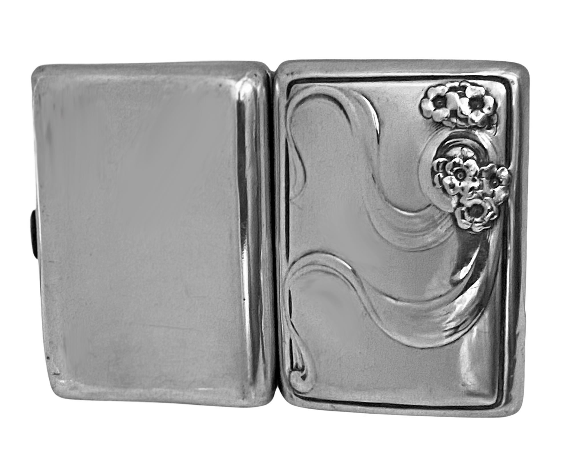 Art Nouveau sterling silver cigarette case London 1902, George Lawrence Connell. Rectangular concave form, the front with art nouveau stylised decoration in relief, interior lightly gilded. Hallmarked inside both cover and and back and thumbpiece.