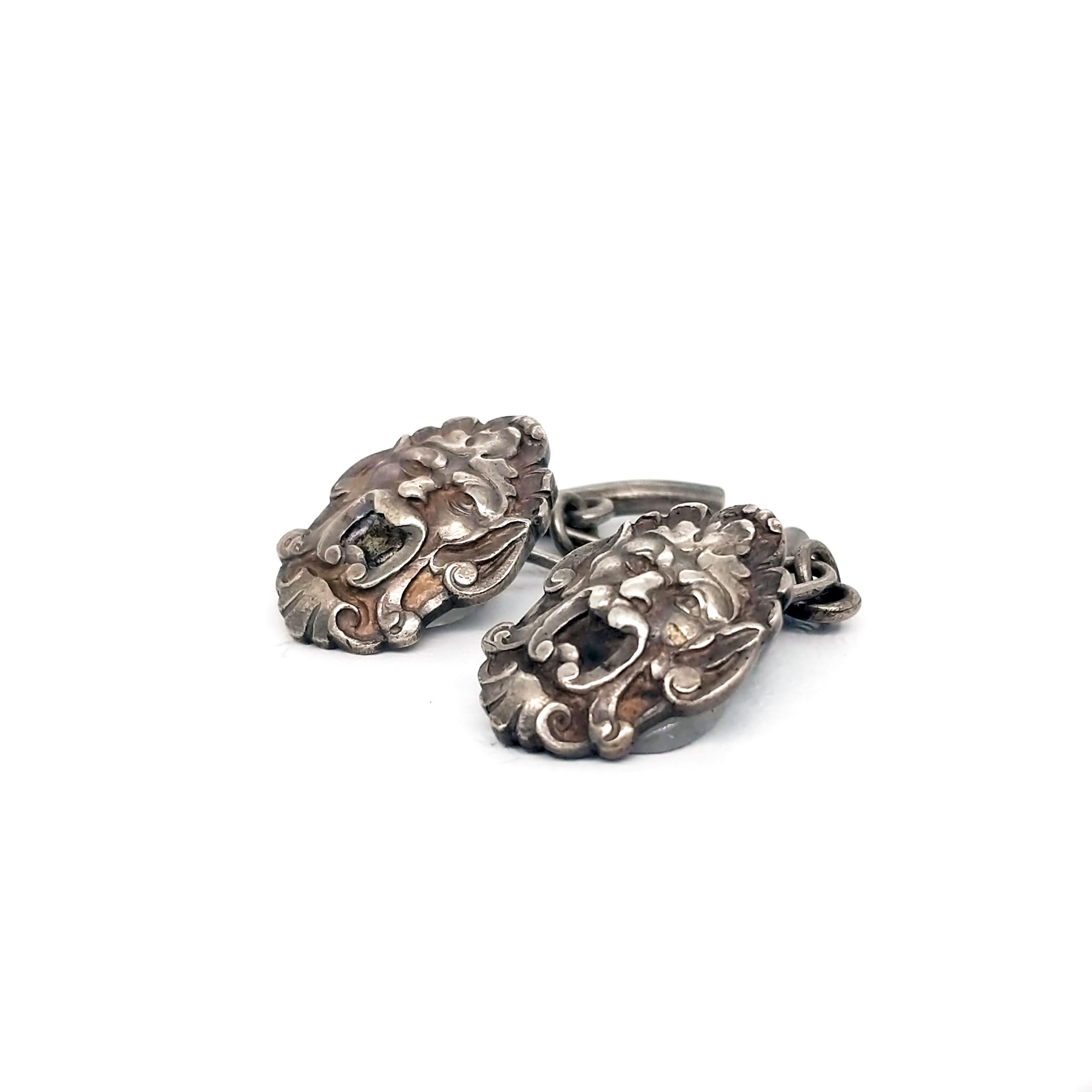 These Art Nouveau cufflinks are sure to wow! Made of sterling silver and hand-engraved with gargoyle faces, these cufflinks are sure to add some spice to your look!  These open-mouthed gargoyles would make just the perfect addition to your
