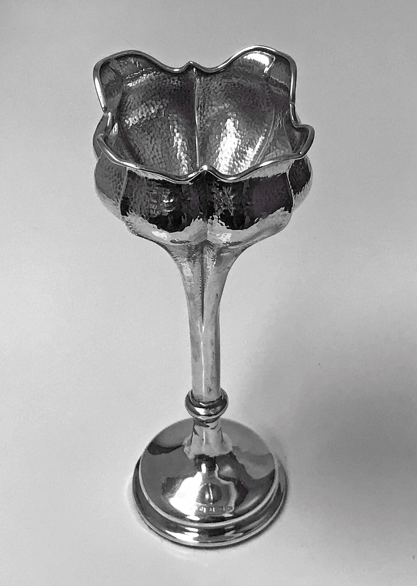 Antique Art Nouveau hammered Sterling Silver flower vase, Birmingham 1902 Henry Matthews. The vase on plain moulded pedestal base, rising to plain knopped stem and flared spot hammered ruffle edge tulip design holder. Measures: Height 7.25 inches.