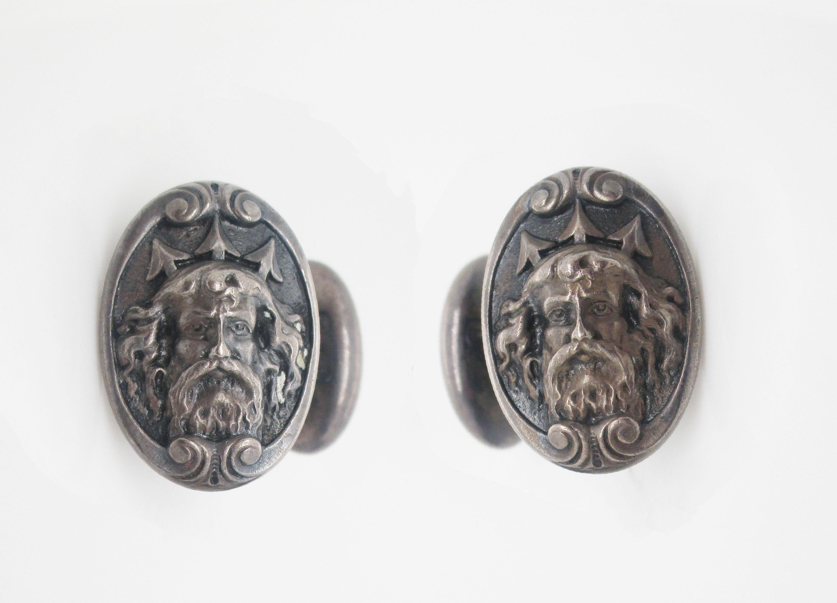 These incredible cufflinks are in sterling silver and feature a fantastically ornate depiction of the sea god Poseidon or Neptune. The detail of the portrait is remarkable-even the hairs of his beard are detailed! The incredibly unique look of these