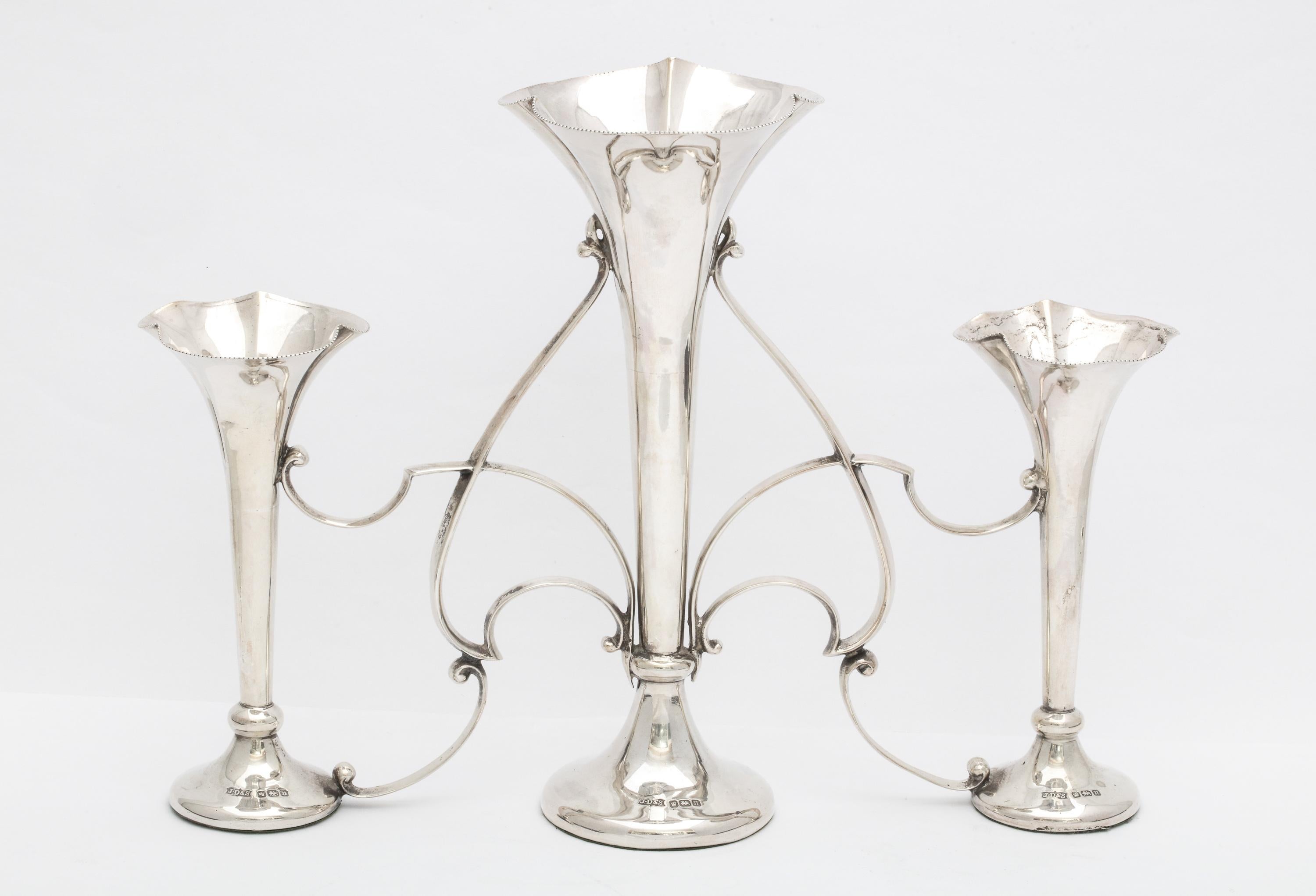 Art Nouveau, sterling silver three-vase epergne/centerpiece, Sheffield, England, 1905, James Dixon and Sons - makers. Measures over 6 3/4 inches high (at highest point) x 9 1/2 inches wide (at widest point) x 3 inches deep (at deepest point).