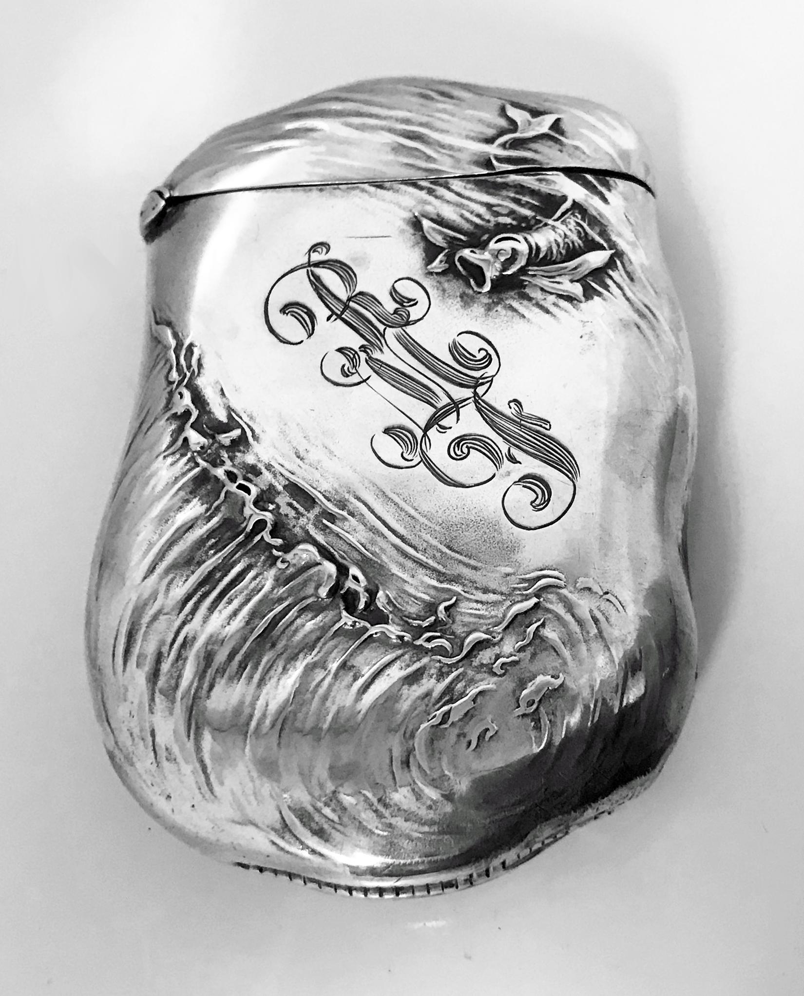 Very Fine quality Art Nouveau Sterling Silver Vesta Match Safe, William Kerr C.1900.  Repousse relief depicting as the central theme on one side, an attractive nude female being adored and pursued by a male suitors frolicking in waves with fish