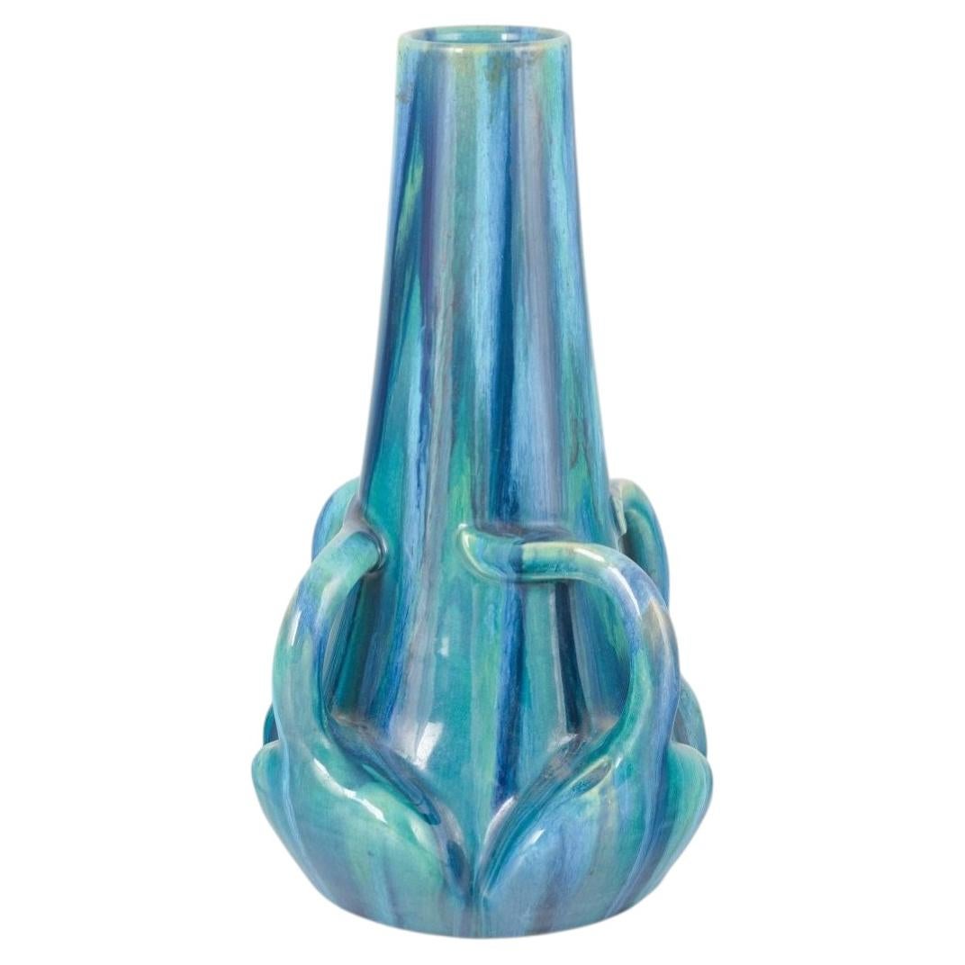 Art Nouveau stoneware vase with sculptural details and blue and green glaze.