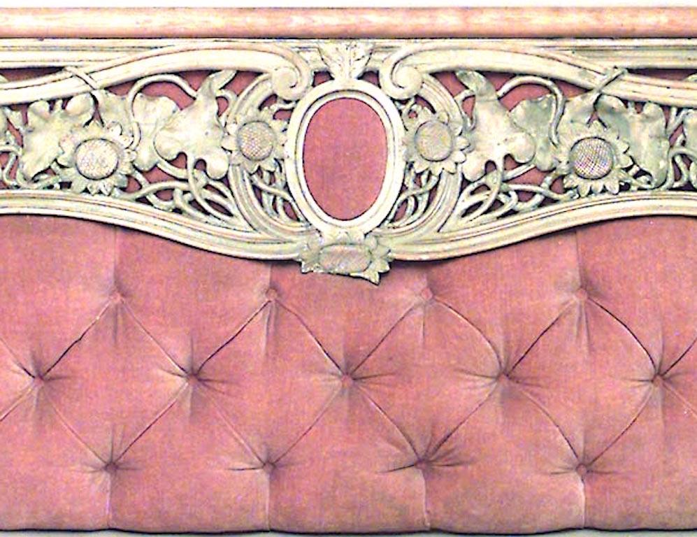 Art Nouveau stripped wall panel with pink velvet inset backing and carved floral filigree design.
