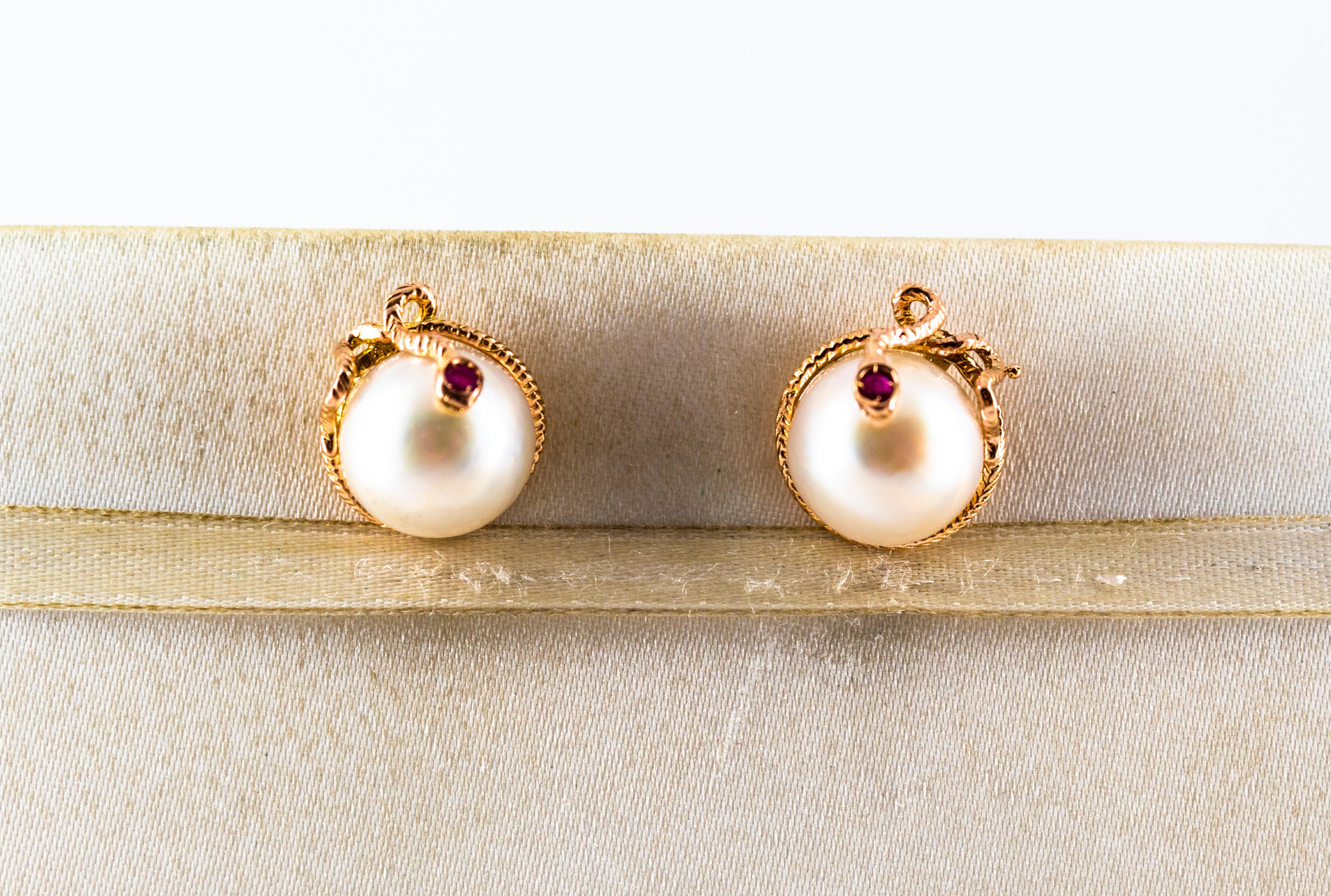 These Earrings are made of 9K Yellow Gold.
These Earrings have 0.12 Carats of Rubies.
These Earrings have two Mabe Pearls.
These Earrings are inspired by Art Nouveau.
These Earrings are available also in a smaller version or with Clips.

All our