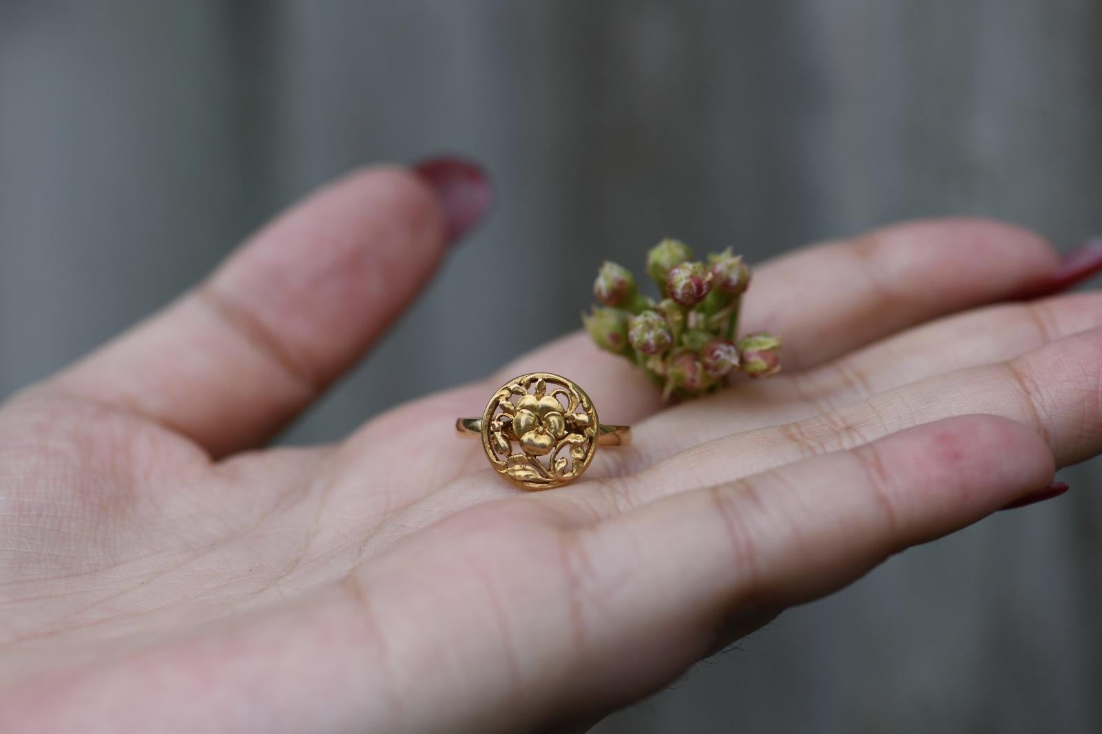 A graceful floral ring, inspired by the Art Nouveau period. A delicately feminine design, enchanting with twists and twines of flowers and leaves.

Designed within a circle, enclosing leaves and vines twisting amongst one another. The contrast of