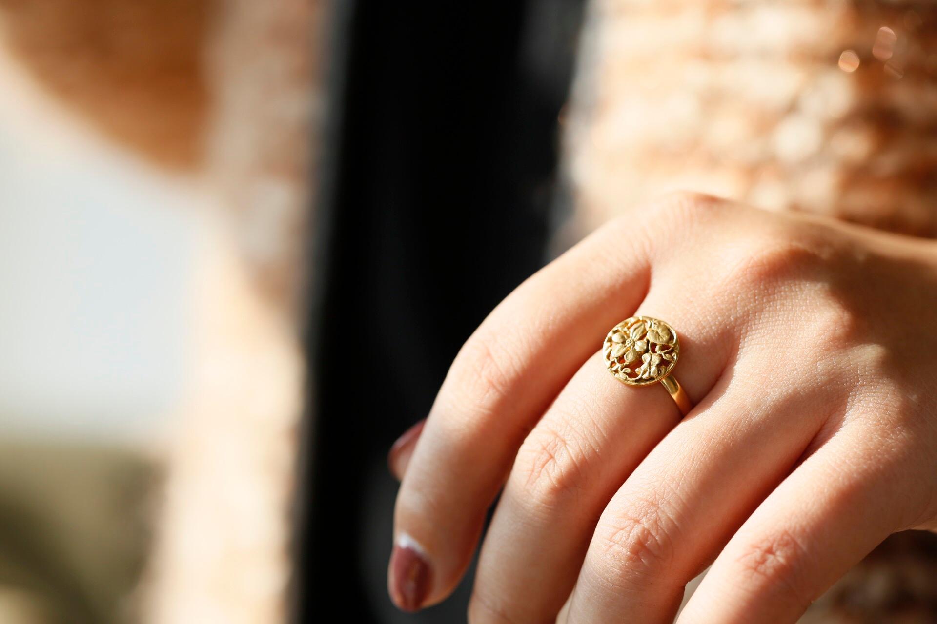 A graceful floral ring, inspired by the Art Nouveau period. A delicately feminine design, enchanting with twists and twines of flowers and leaves.

Designed within a circle, enclosing leaves and vines twisting amongst one another. The contrast of