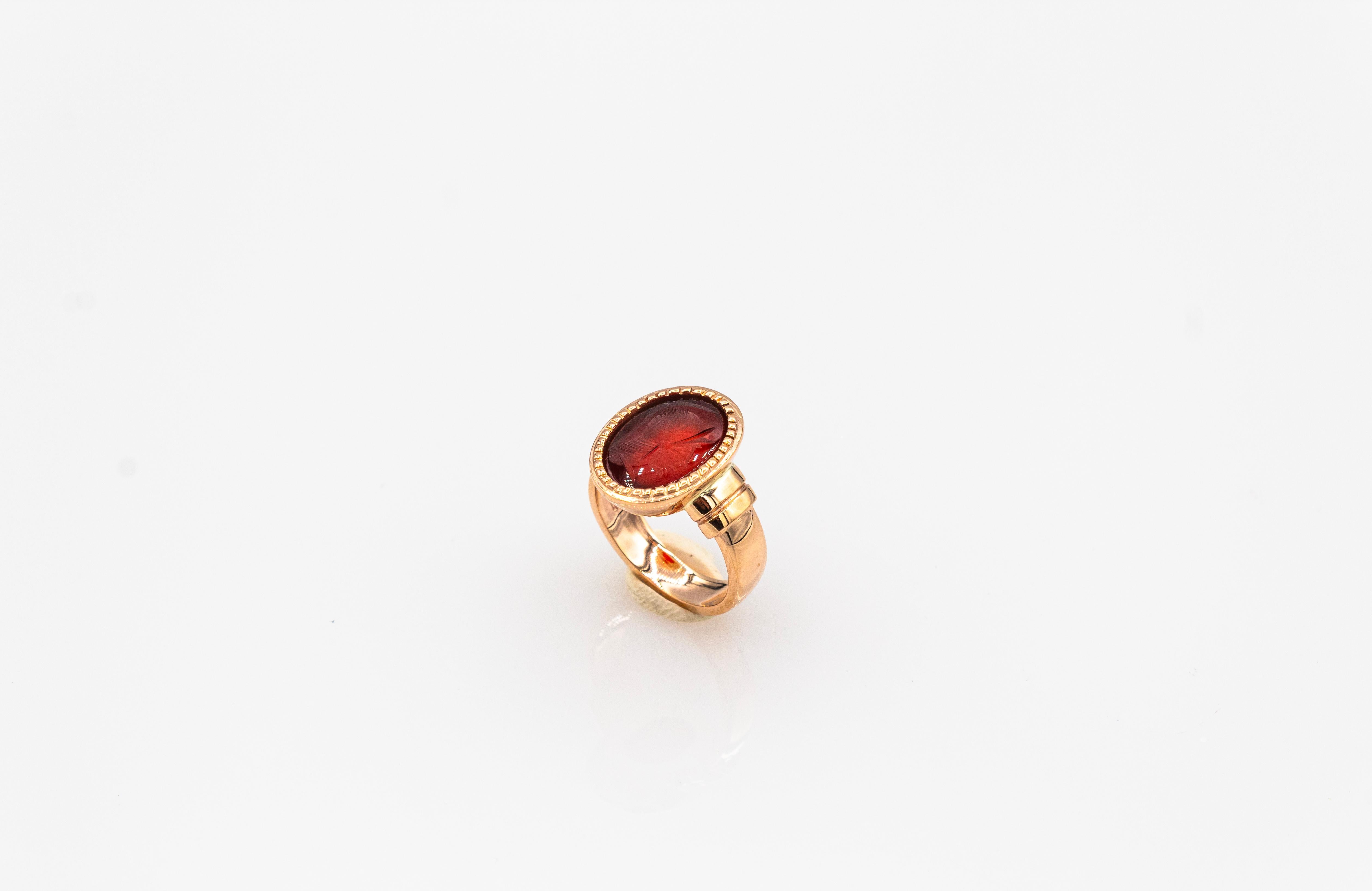Oval Cut Art Nouveau Style 4.20 Carats Carved Red Carnelian Yellow Gold Cocktail Ring For Sale