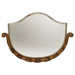Espejo biselado de estilo Art Nouveau con volutas ornamentadas y decoración vegetal