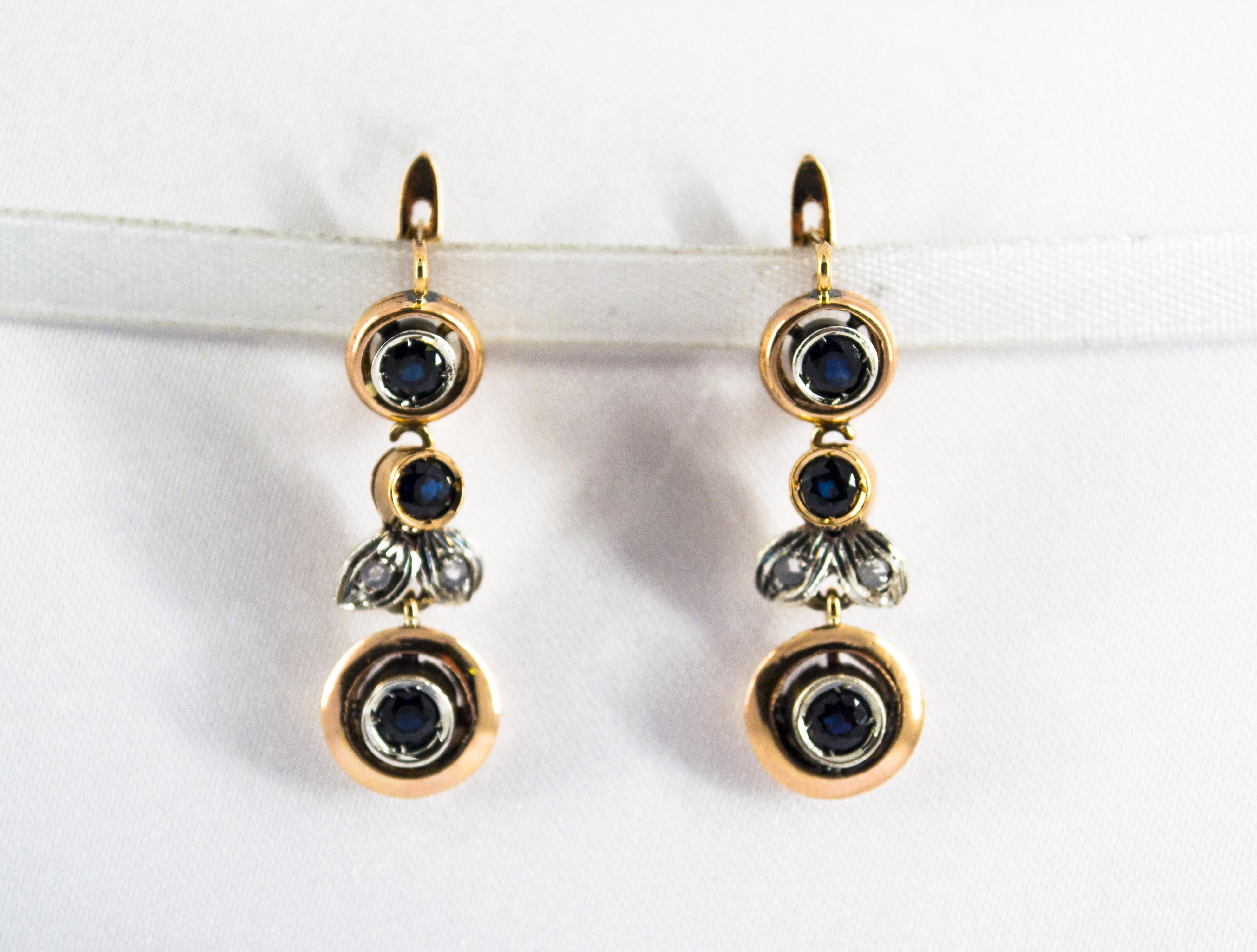 These Lever-Back Earrings are made of 9K Yellow Gold and Sterling Silver.
These Earrings have 0.04 Carats of White Rose Cut Diamonds.
These Earrings have also 1.00 Carat of Blue Sapphires.
These Earrings are available also with Ruby or Emerald.

All
