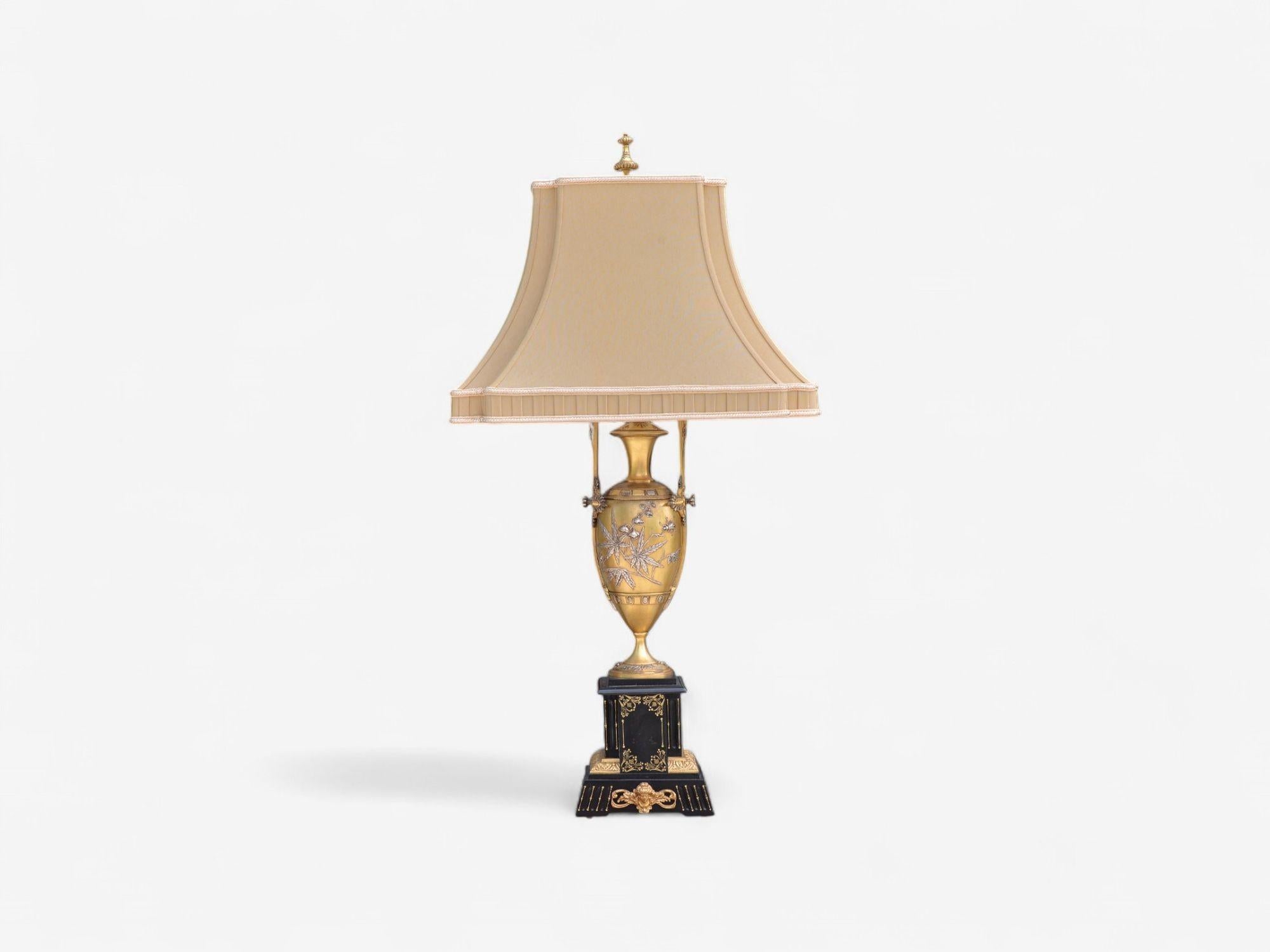 Art Nouveau Style, Bronze, Ebony, Linen, Table Lamps, France, 1920s

Pair of exquisite French Art Nouveau table lamps, each has silver overlay gilt bronze urn supported by a marble block base depicting Japanese maple leaves with insects. The base