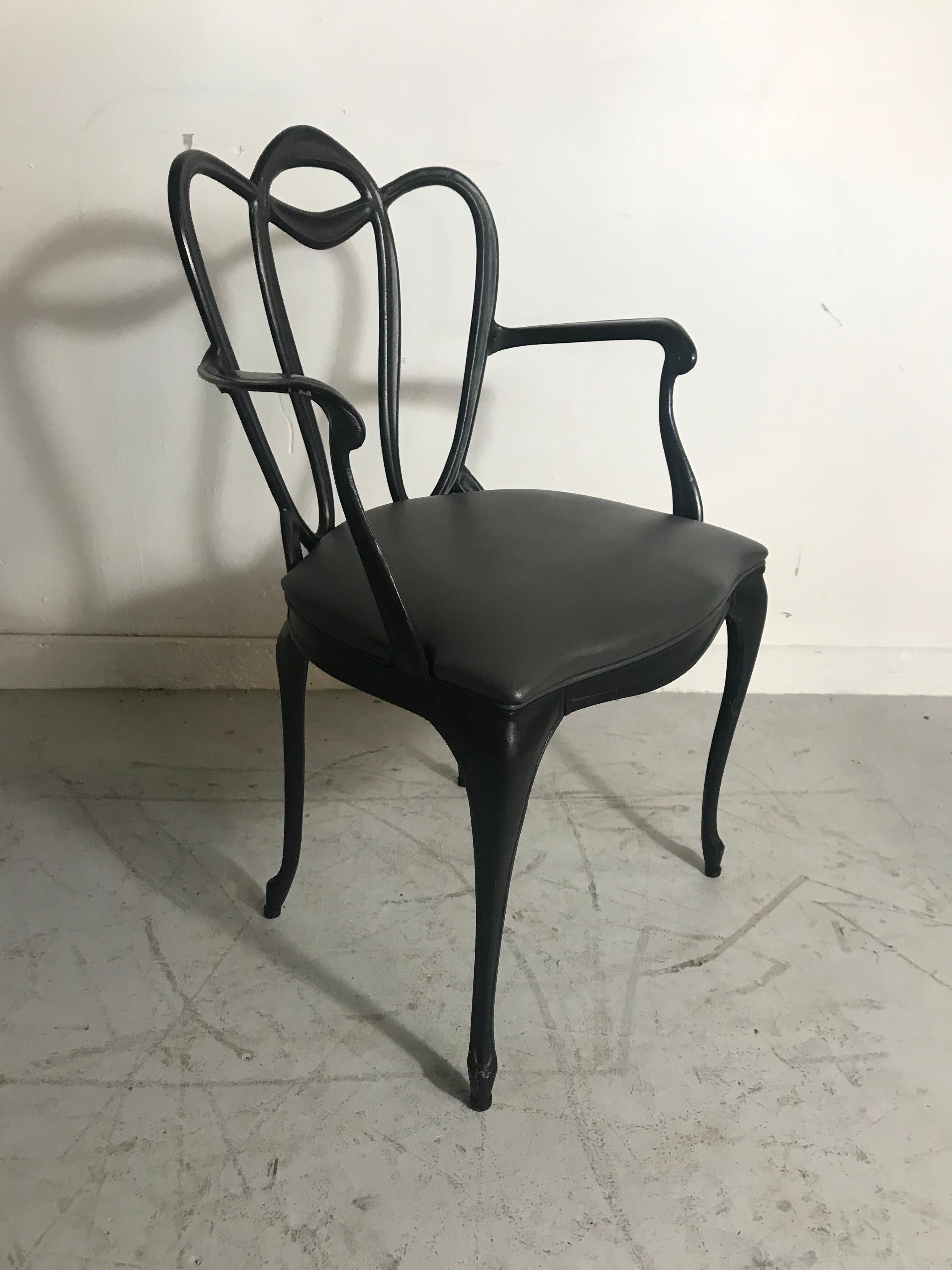 Art Nouveau style cast aluminum armchair by Crucible Products Corp. 1960, amazing design, extremely comfortable, retains original dark gray Naugahyde seat as well as original paper label, arm height 24.5
