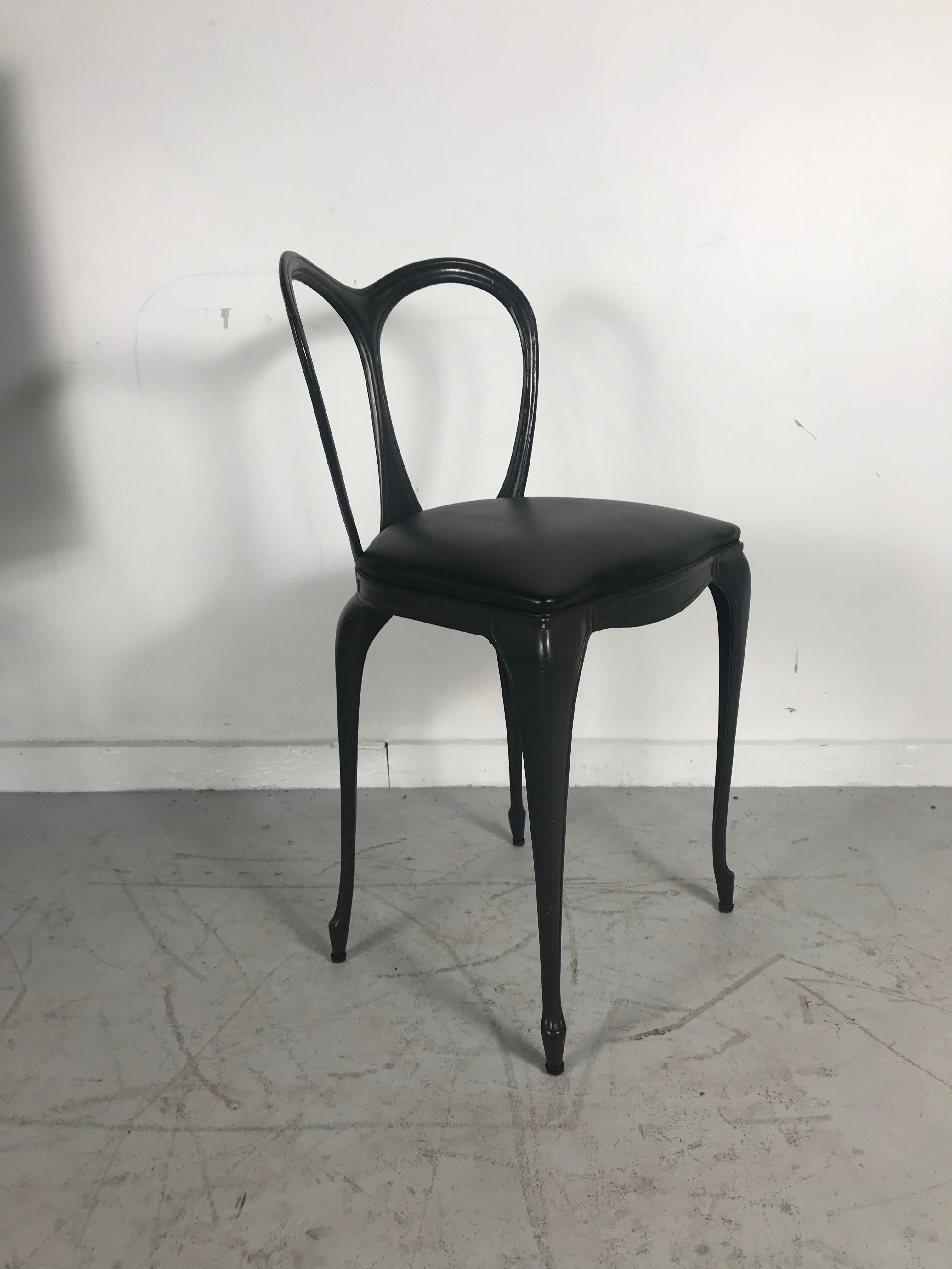 Art Nouveau style cast aluminum chair by Crucible Products Corp. 1960, amazing design, extremely comfortable, retains original dark gray Naugahyde seat as well as original paper label, unusual 21
