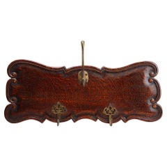 Art Nouveau style coat rack in oak with brass hooks, France ca. 1915