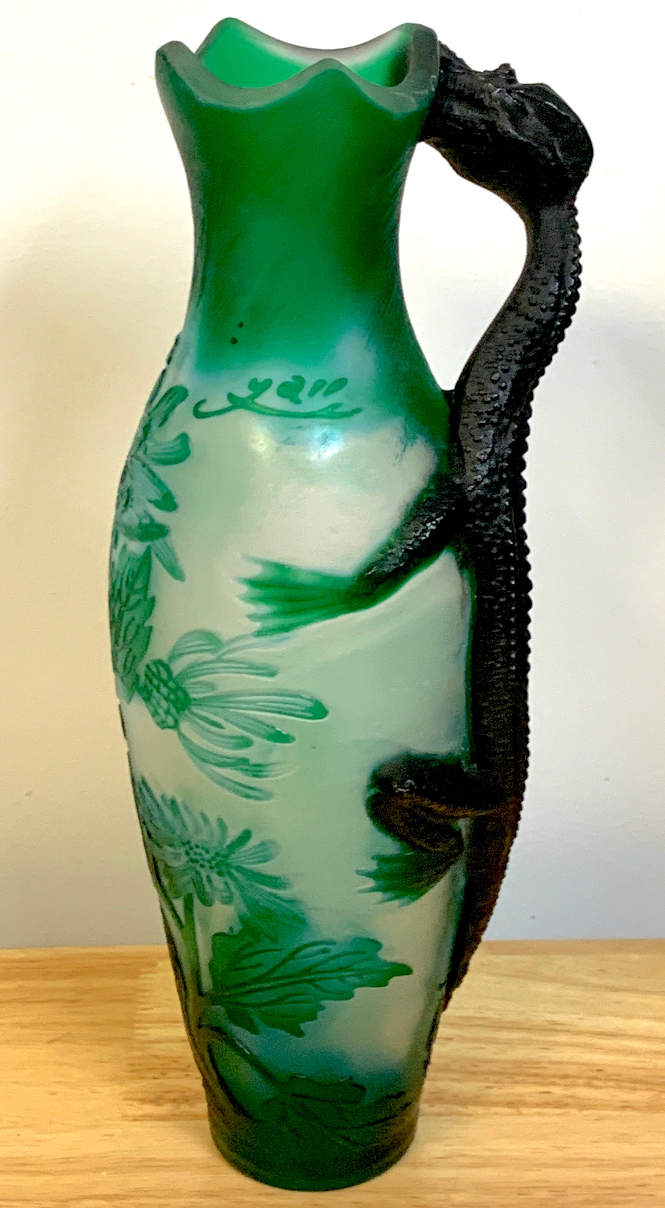 Art Nouveau style dragon motif cameo glass ewer/vase, After Emile Gallé, with applied dragon handle, finely carved florals, with cameo signature.

 