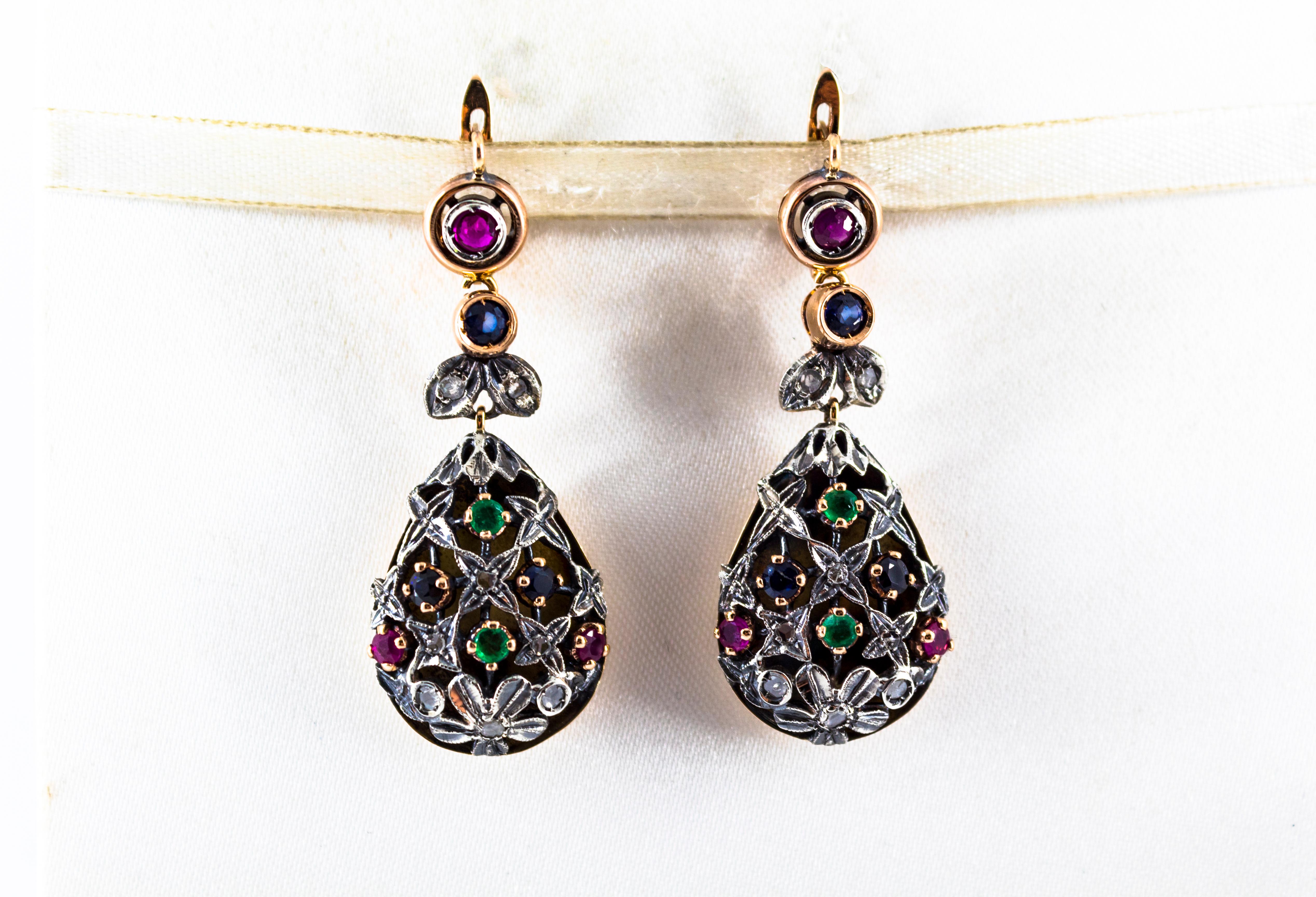 These Earrings are made of 9K Yellow Gold and Sterling Silver.
These Earrings have 0.25 Carats of White Rose Cut Diamonds.
These Earrings have also 1.10 Carats of Rubies, Emeralds and Blue Sapphires.

All our Earrings have pins for pierced ears but