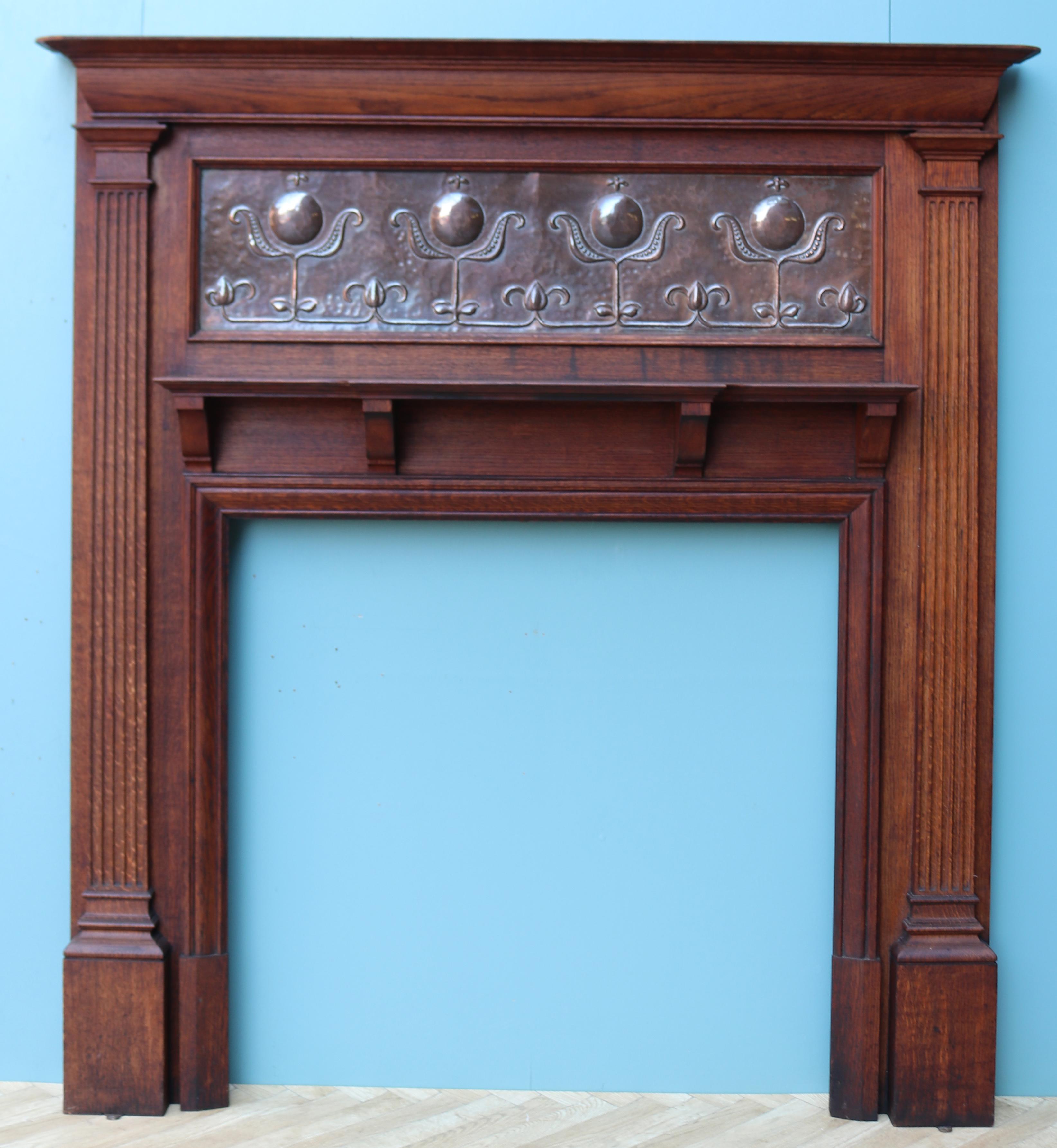 An Art Nouveau period fireplace constructed from oak, with a repoussé copper frieze panel.

Additional Dimensions:

Opening height 96 cm

Opening width 97 cm

Width between outside of foot blocks 148 cm.