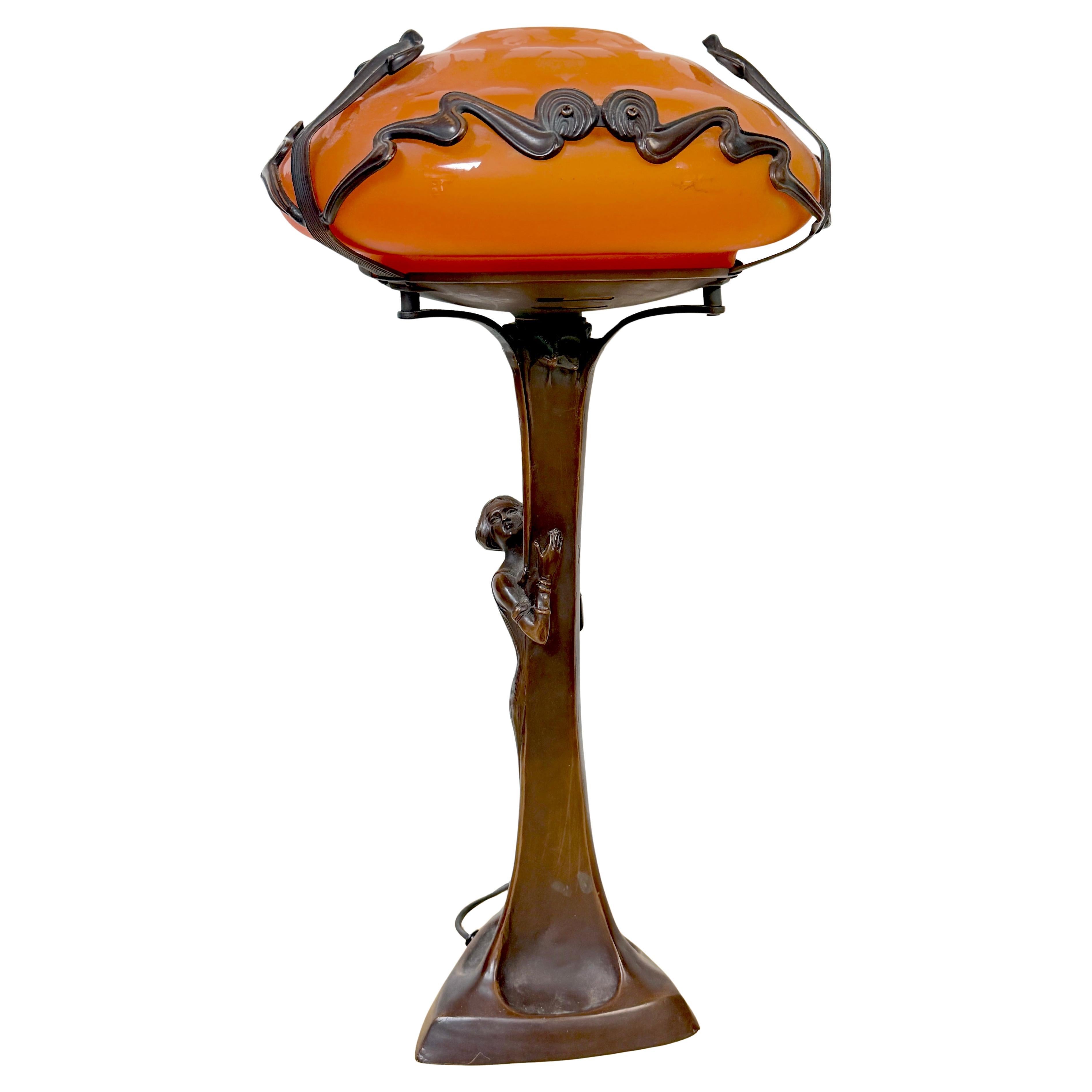 Art Nouveau Style Figural Bronze Lamp Loetz Style Orange Art Glass Shade, 20th C