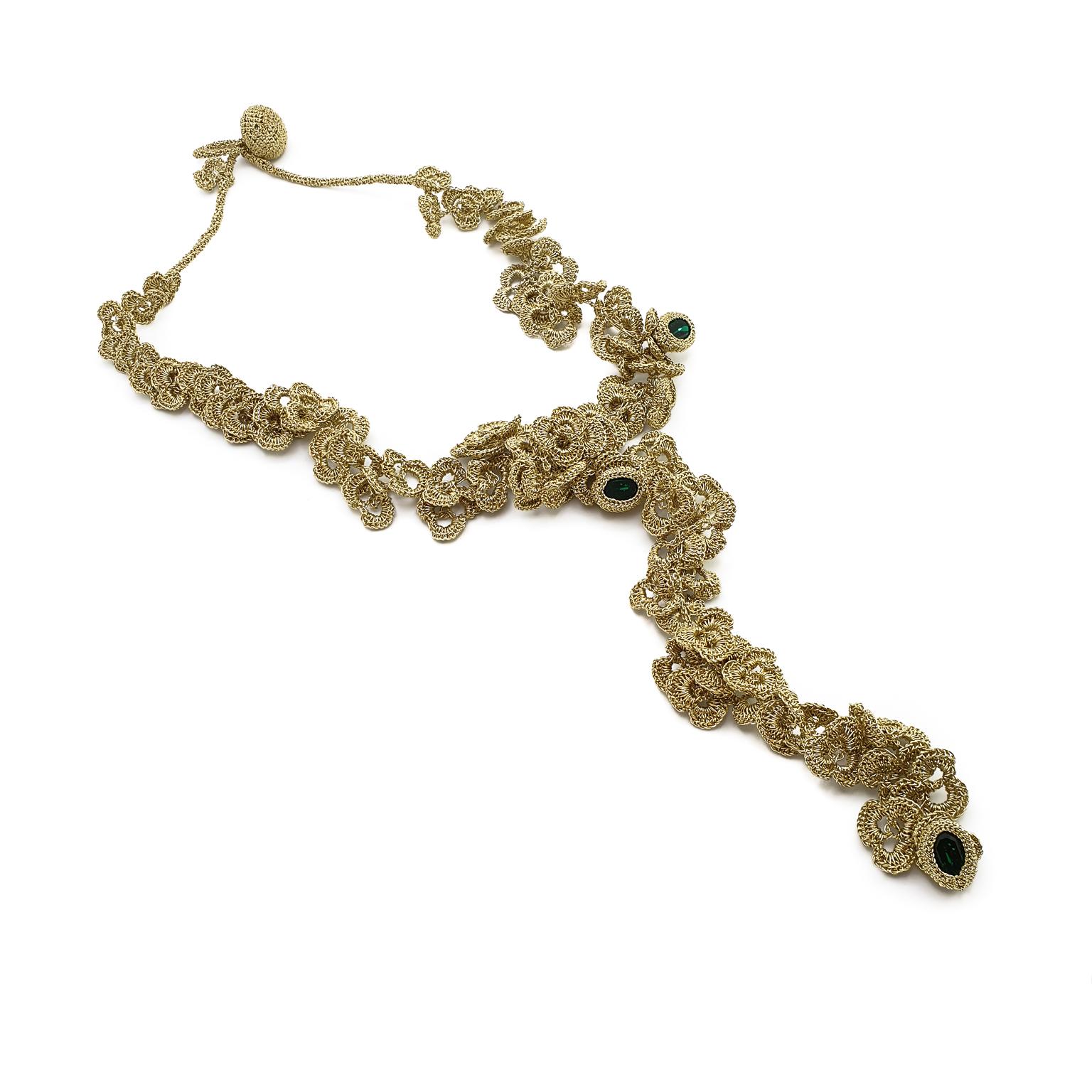 This is an Art Nouveau style crochet necklace. This necklace can be custom made and the choice of stones can be altered.

The necklace is crochet with a smooth passing thread. It is a cotton thread coated with a gold color polymer. It has no metal