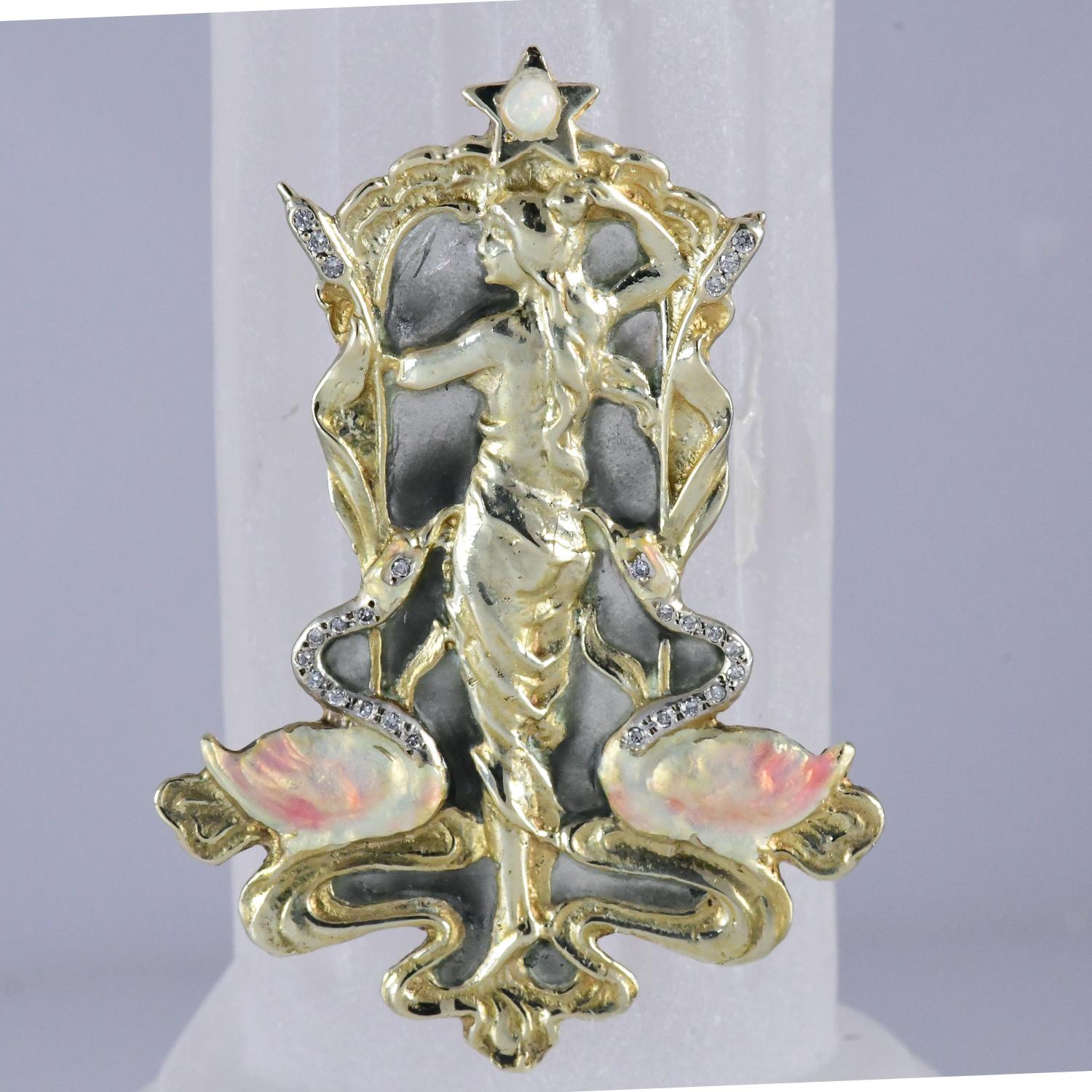 Art Nouveau style lady of the water, diamond neck swans with enameled bodies, diamond cat tails, intricate enameled background, 14kt yellow gold 16.8 gms, Diamonds .14 GH SI1-SI2, natural opal star. The pendant/brooch contains a locking bar pin and