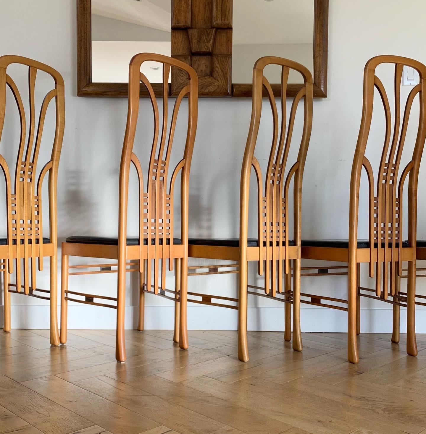 A very unique set of 6 Art Nouveau / Art Deco Frank Lloyd Wright style dining chairs by Masterly, early 1960s. Made in Italy. Hand-crafted wood with whiplash curved backs, flare legs, and black leather (real leather) seats. Minor signs of age - for