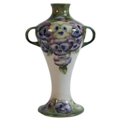 Art Nouveau style MOORCROFT PANSY pattern twin-handled vase.