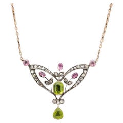 Antique Art Nouveau style necklace with diamonds, peridots and tourmalines, circa 1900s.