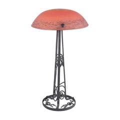 Art Nouveau-style table lamp in cast iron and art glass. France, mid-20th C.