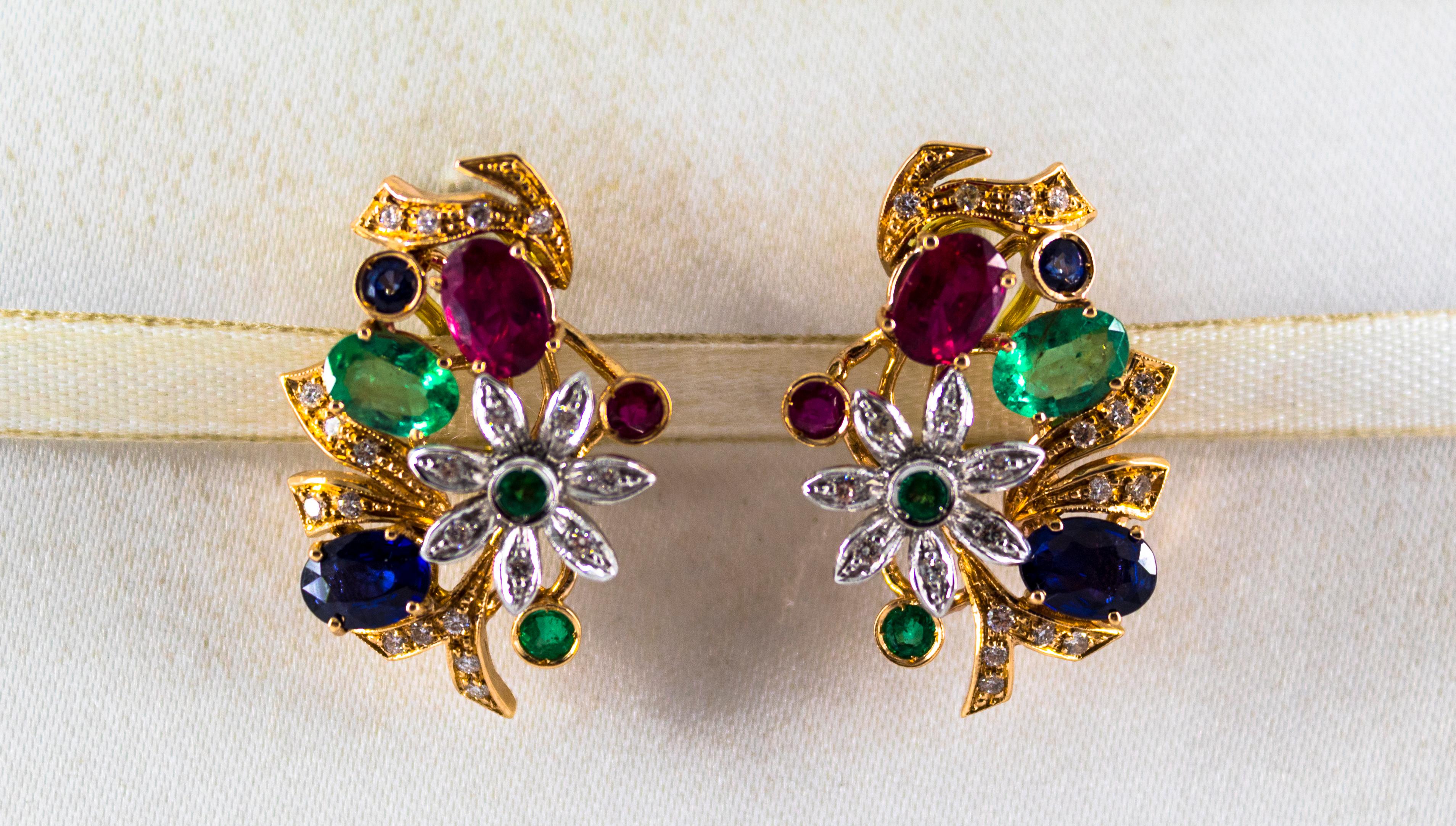 These Clip-On Earrings are made of 14K Yellow Gold.
These Earrings have 0.40 Carats of White Brilliant Cut Diamonds.
These Earrings have 1.80 Carats of Emeralds.
These Earrings have 1.70 Carats of Rubies.
These Earrings have 1.70 Carats of Blue