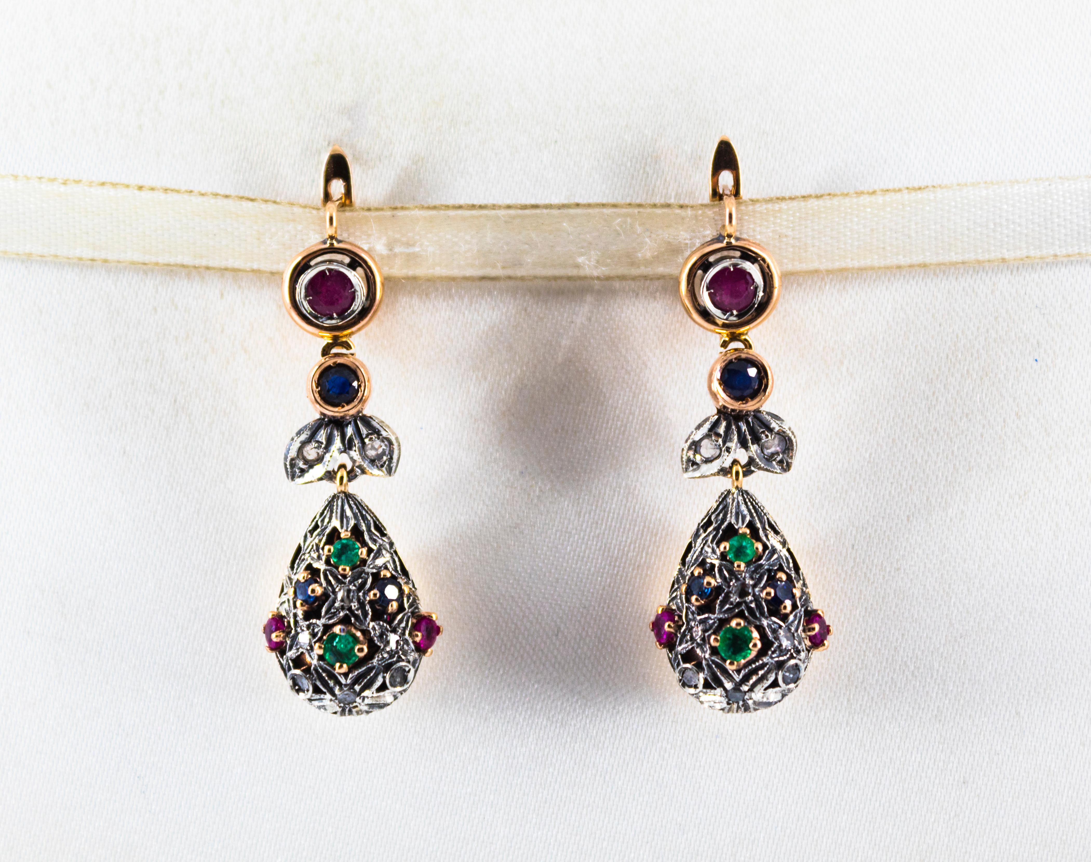 These Earrings are made of 9K Yellow Gold and Sterling Silver.
These Earrings have 0.25 Carats of White Rose Cut Diamonds.
These Earrings have also 1.10 Carats of Rubies, Emeralds and Blue Sapphires.

All our Earrings have pins for pierced ears but