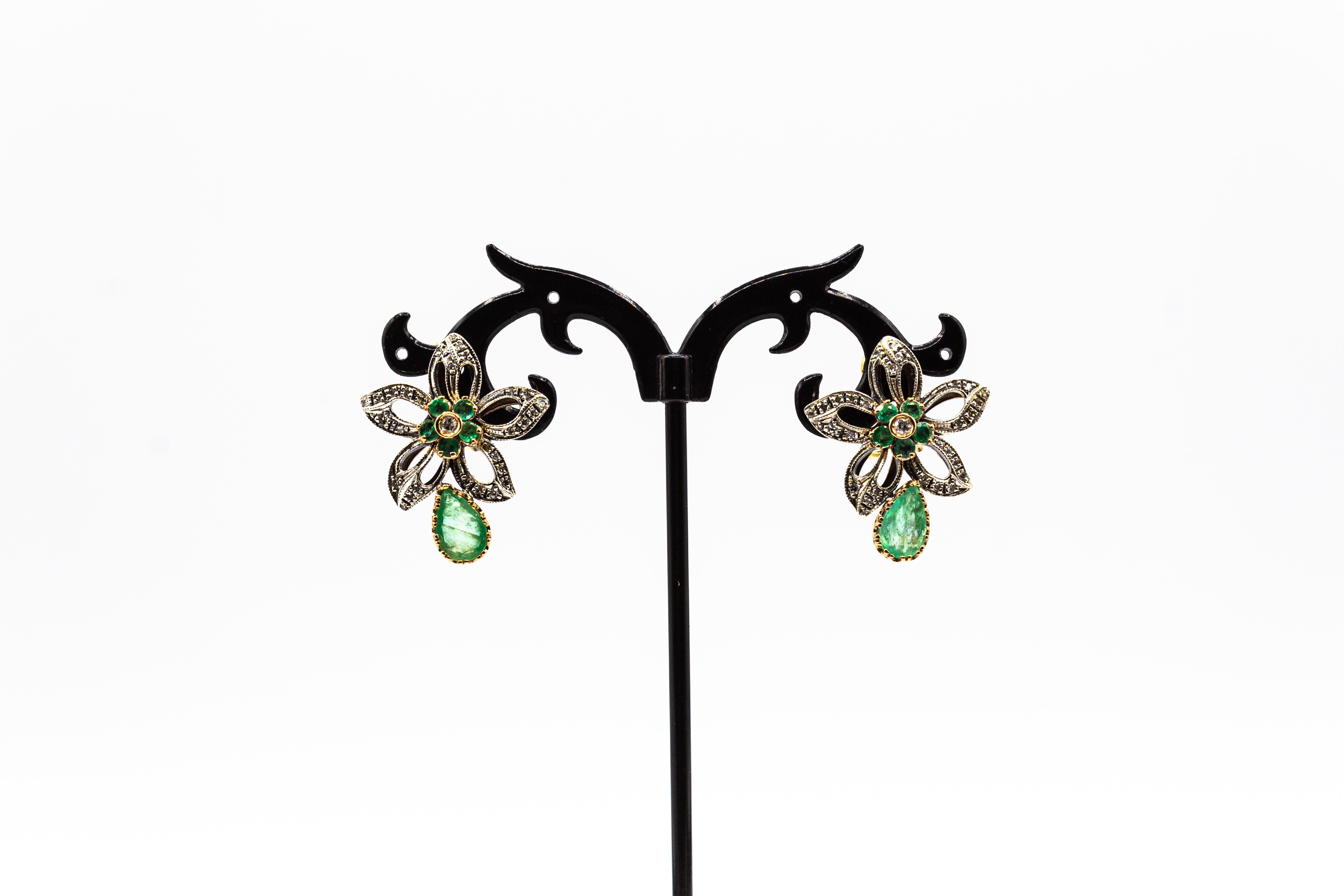 These Clip-On Earrings are made of 9K Yellow Gold and Sterling Silver.
These Earrings have 0.60 Carats of White Old European Cut Diamonds.
These Earrings have also 2.80 Carat of Pear Cut and Round Cut Emeralds.

These Earrings are available also