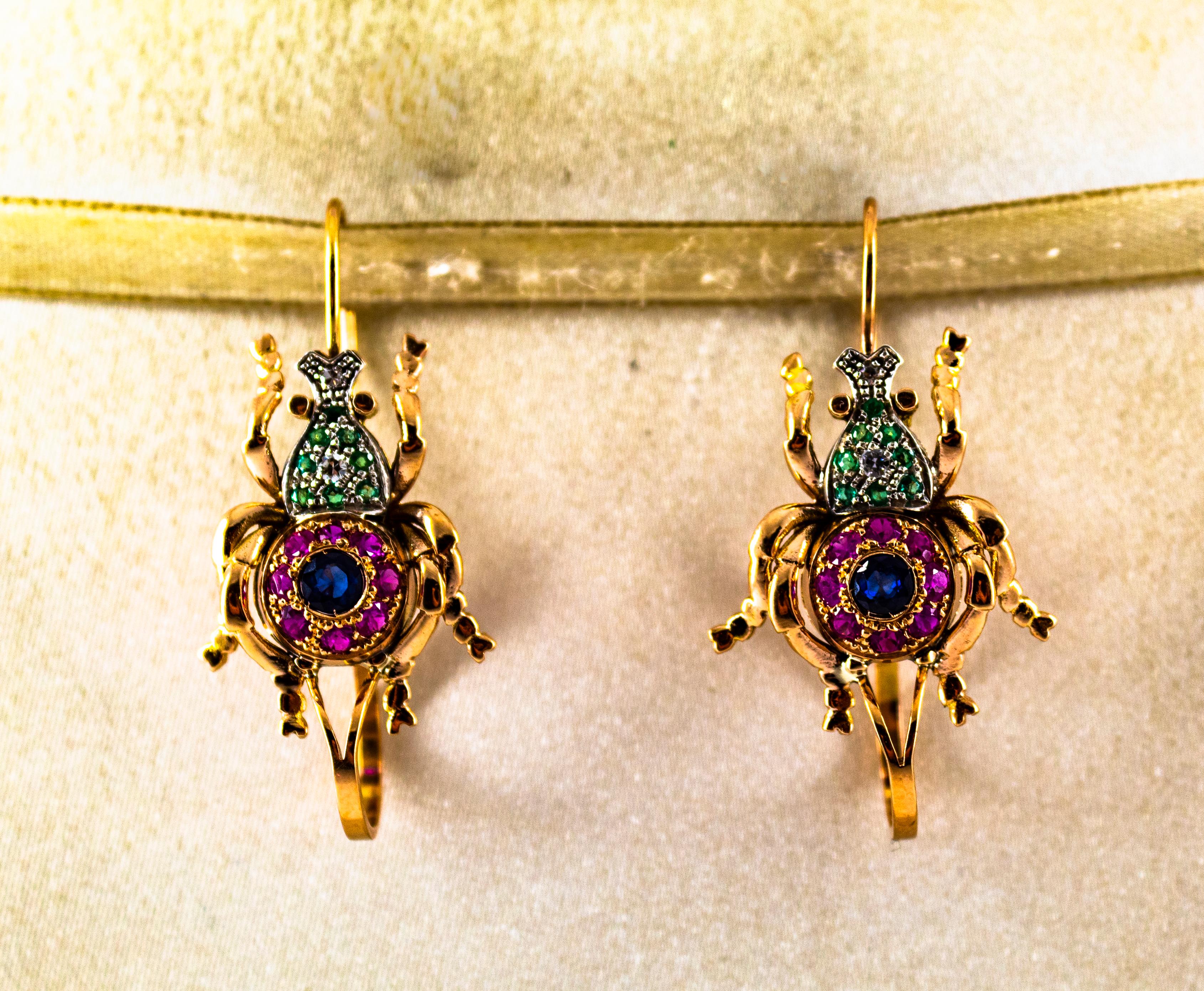 These Earrings are made of 9K Yellow Gold and Sterling Silver.
These Earrings have 0.08 Carats of White Brilliant Cut Diamonds.
These Earrings have 0.40 Carats of Emeralds.
These Earrings have 0.80 Carats of Rubies.
These Earrings have 1.40 Carats