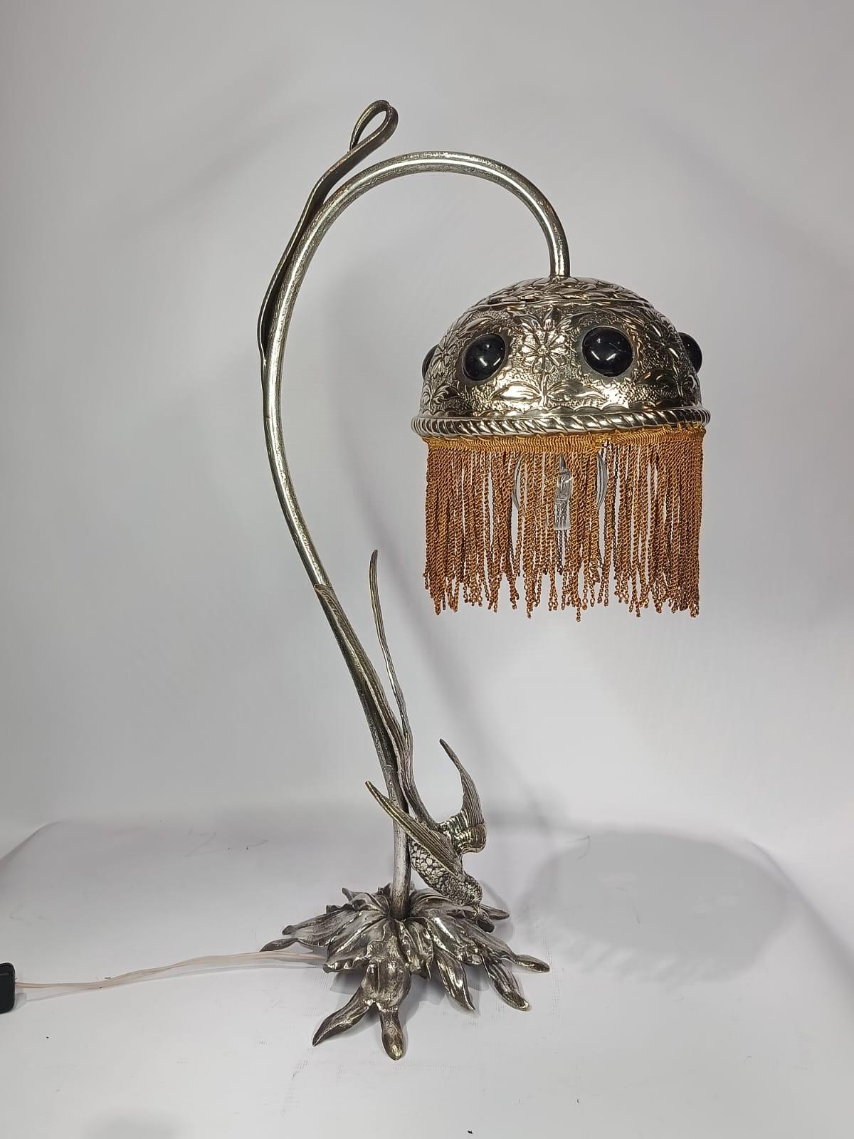 Art Nouveau Swallow Bird Table Lamp
Origin: Austria
Circa 1910
Art Nouveau Style
120 W electrific
Electroplated bronze and red glass, jewels, and relief floral decoration
Exelent condition
Art Nouveau, an artistic style that flourished between