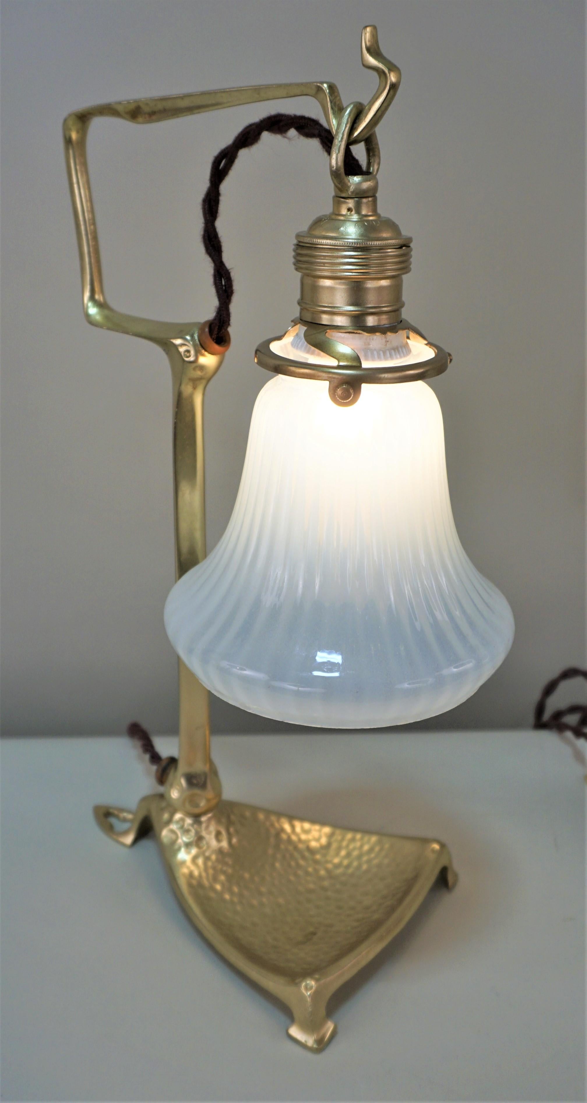 Pair of Friedrich Adler bronze Art Nouveau table or wall lamp with praline glass shades.
Price is for the pair